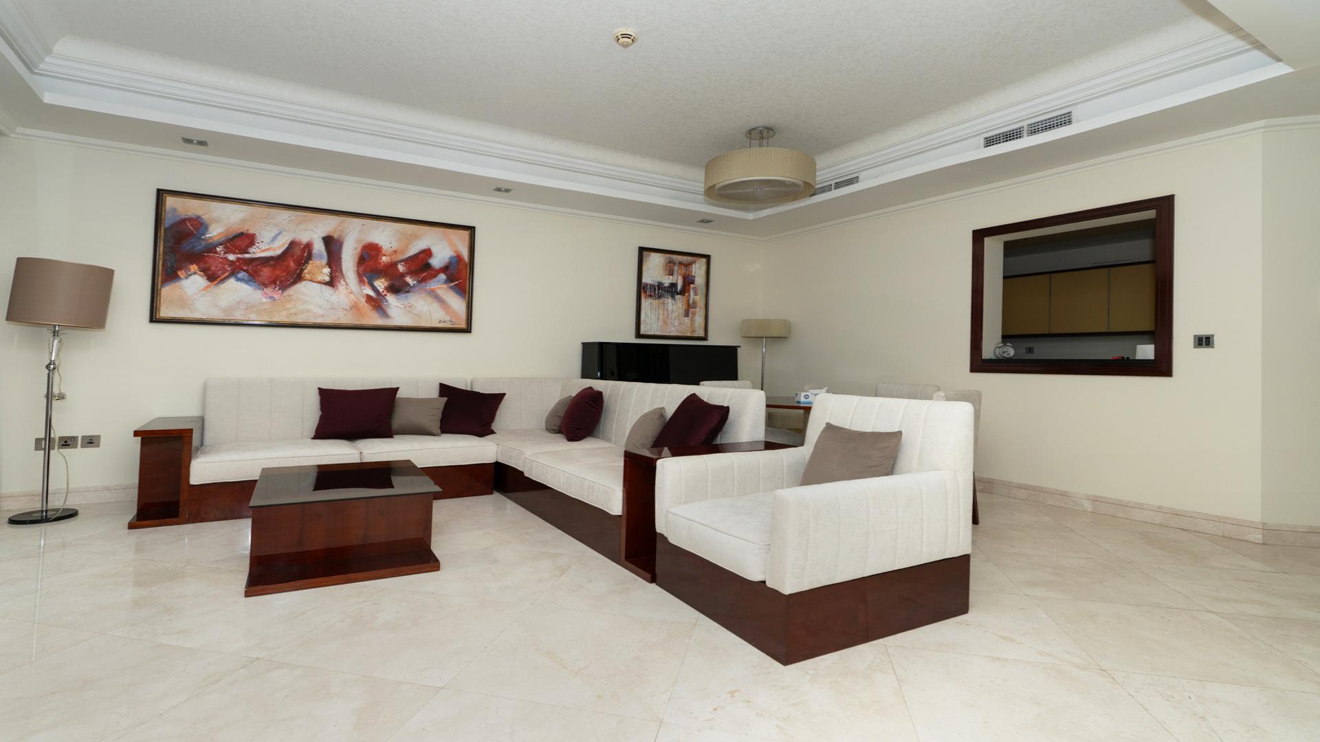 Luxurious living room in Grandeur Residences apartment, Palm Jumeirah, featuring modern decor