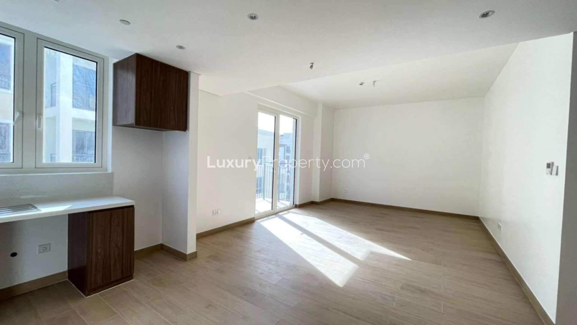 Bright living area with balcony in La Mer apartment, Jumeirah, available for rent