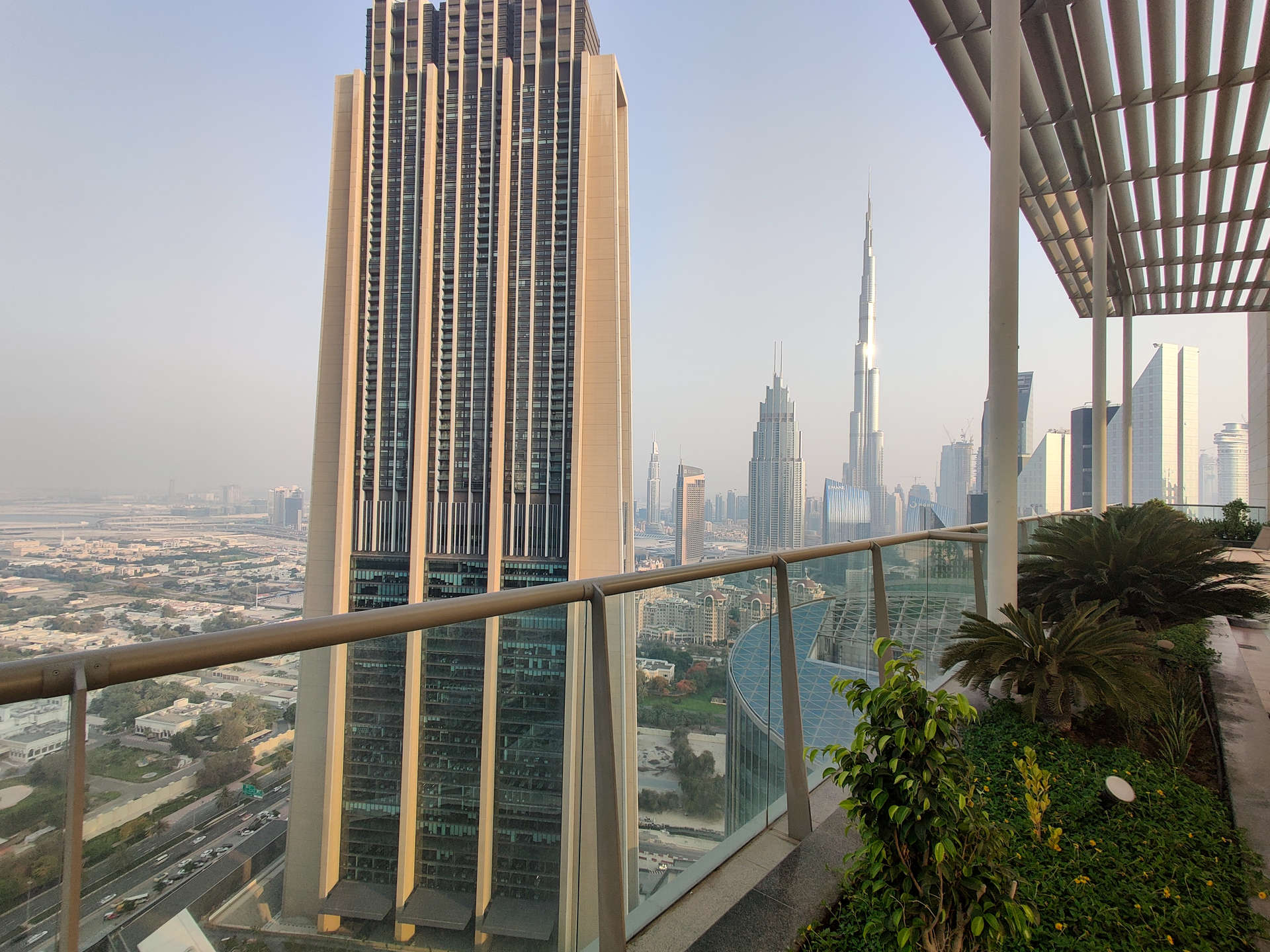 Modern kitchen in 1-bedroom furnished apartment, Liberty House, DIFC, with sleek white cabinetry