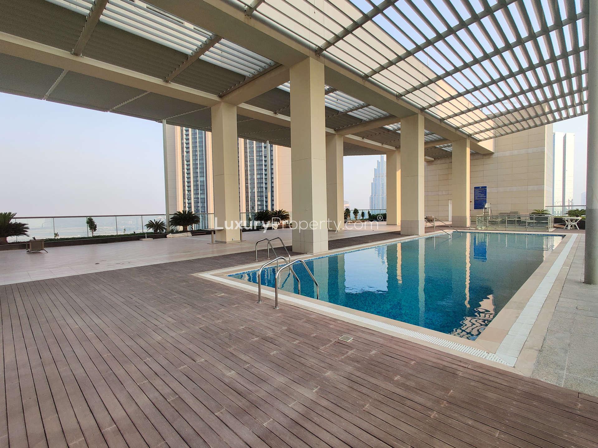 Balcony view from Liberty House apartment, overlooking DIFC skyline and iconic Burj Khalifa