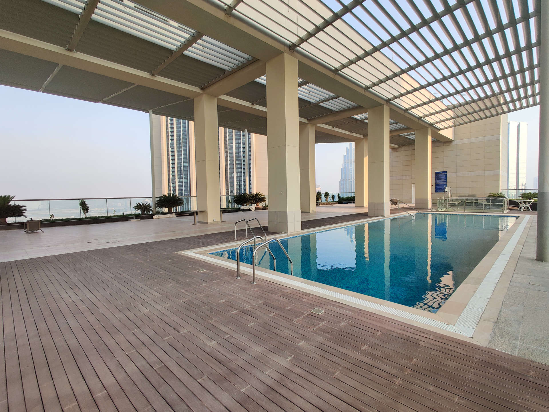 Balcony view from Liberty House apartment, overlooking DIFC skyline and iconic Burj Khalifa