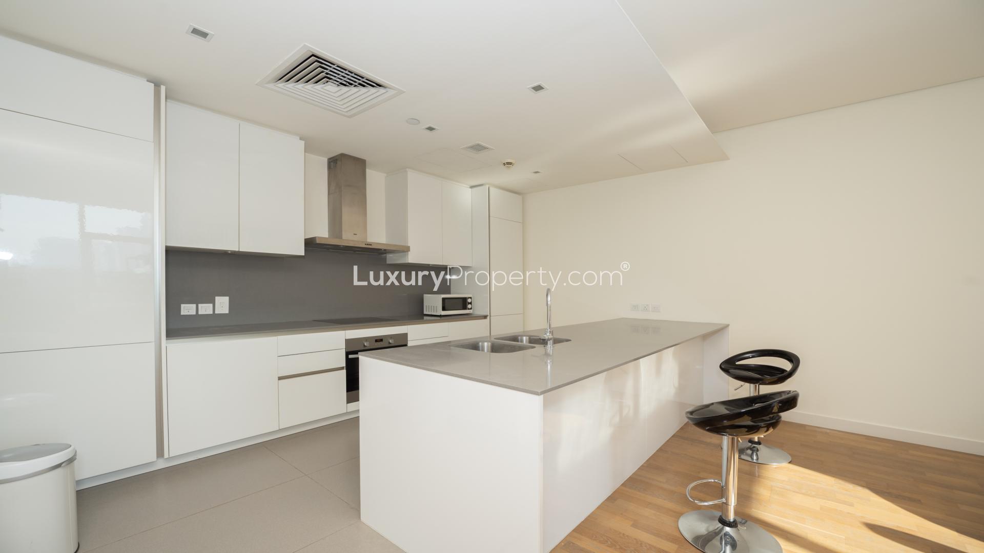 Stylish City Walk apartment living area with modern furniture and large windows for rent