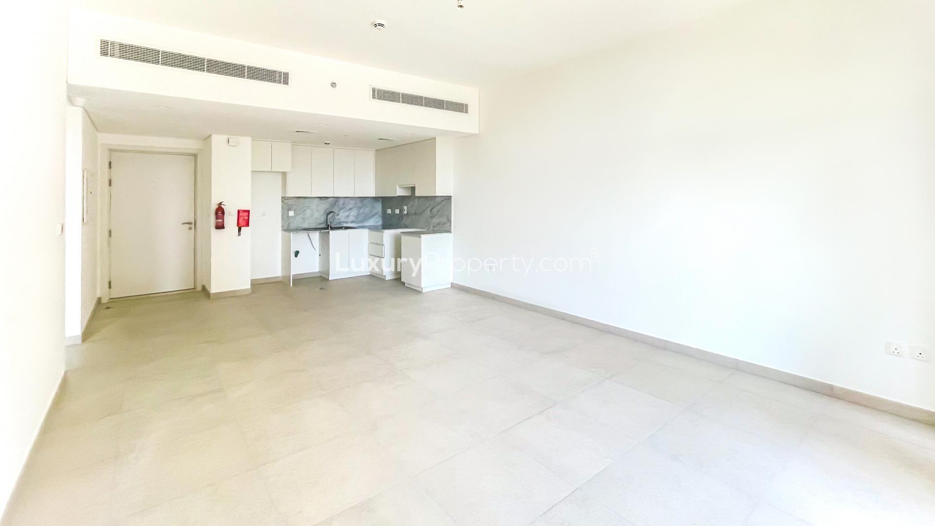 Empty apartment interior with modern kitchen in Madinat Jumeirah Living, Umm Suqeim