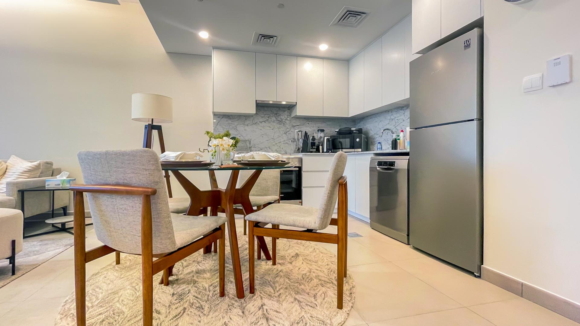 Modern kitchen and dining area in fully furnished MJL apartment for rent, Umm Suqeim