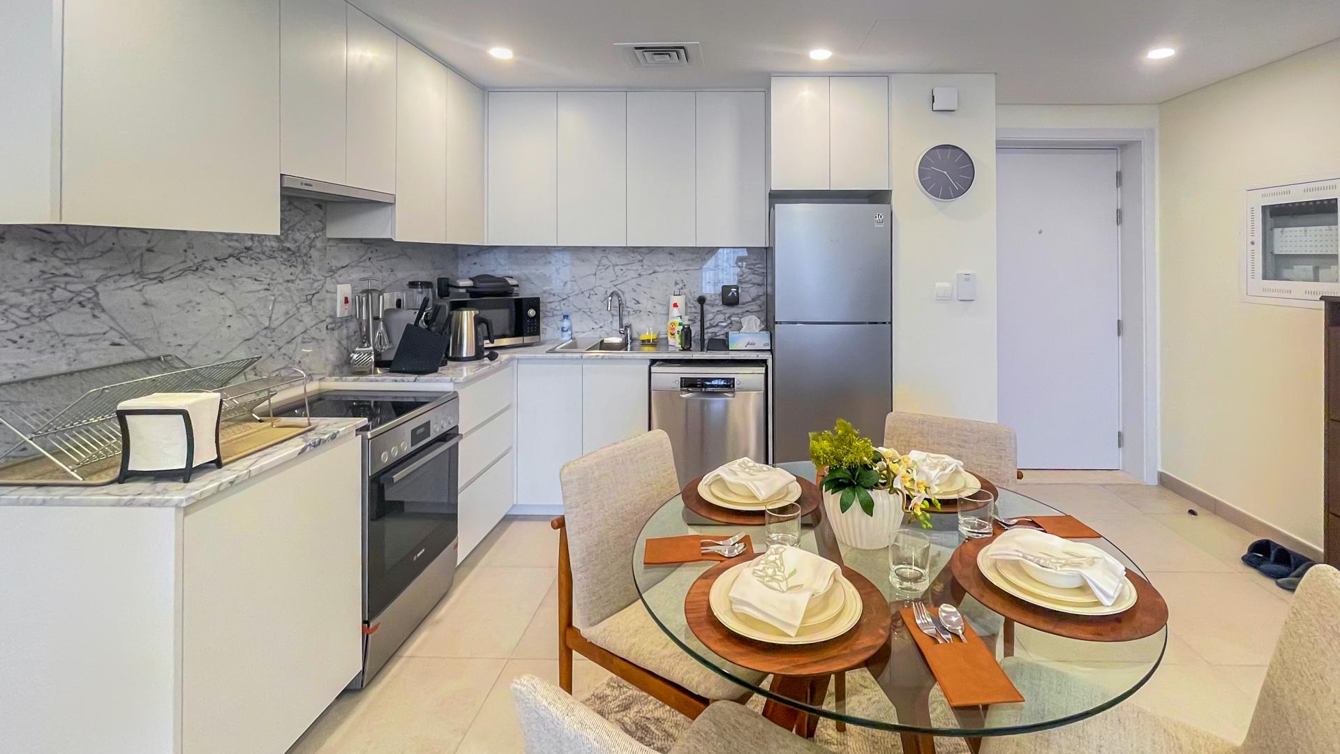 Fully furnished living room in Madinat Jumeirah Living apartment, modern decor and cozy seating