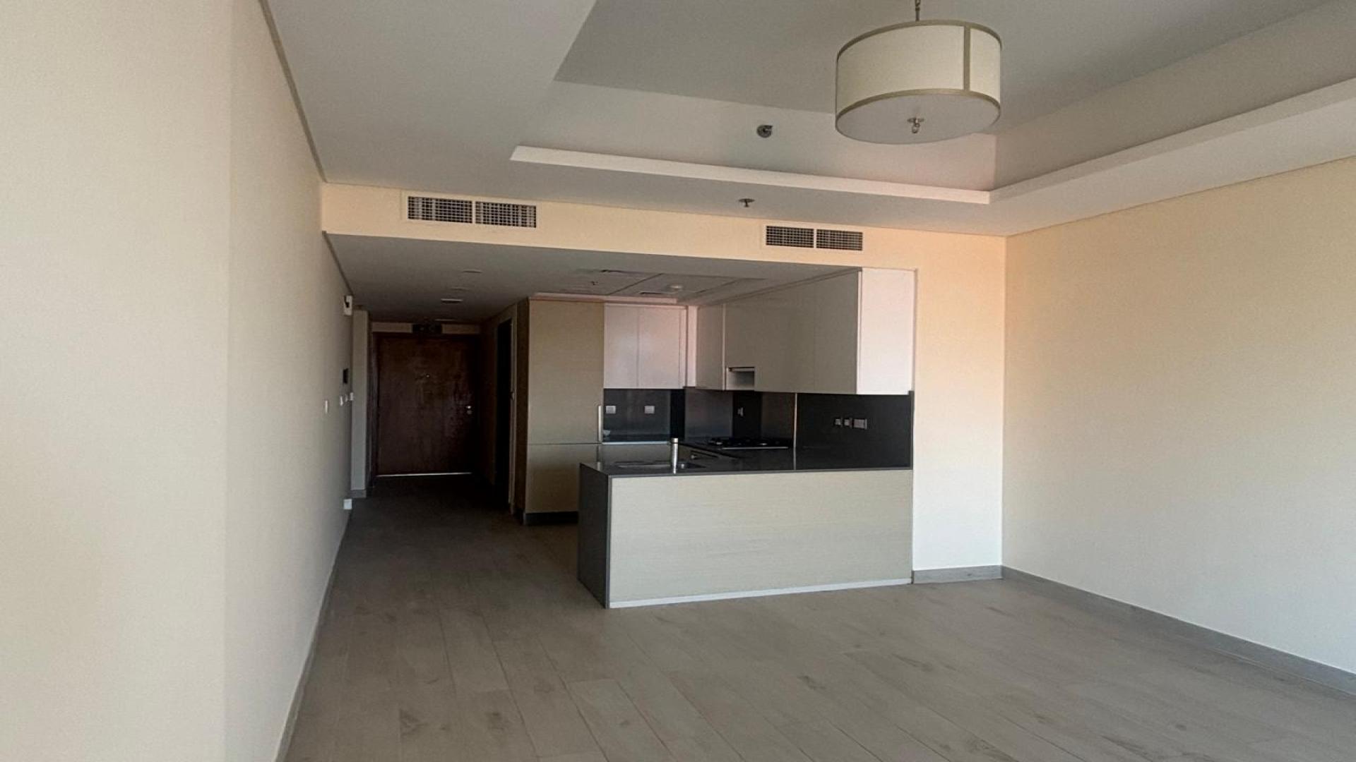 Modern kitchen in one-bedroom apartment at Azizi Mina, Palm Jumeirah, available for rent