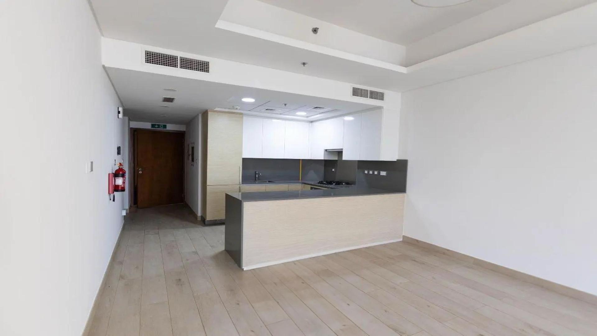 Empty modern apartment interior with light wood flooring in Azizi Mina, Palm Jumeirah