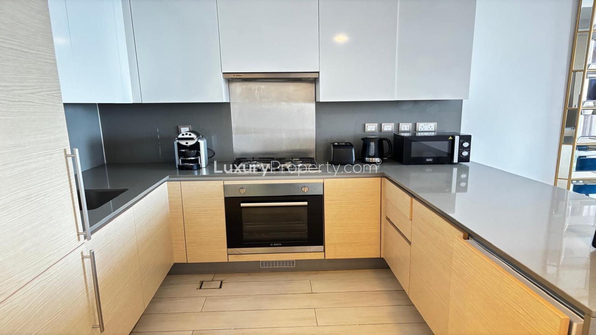 Furnished dining area and kitchen in Azizi Mina apartment, Palm Jumeirah, for rent