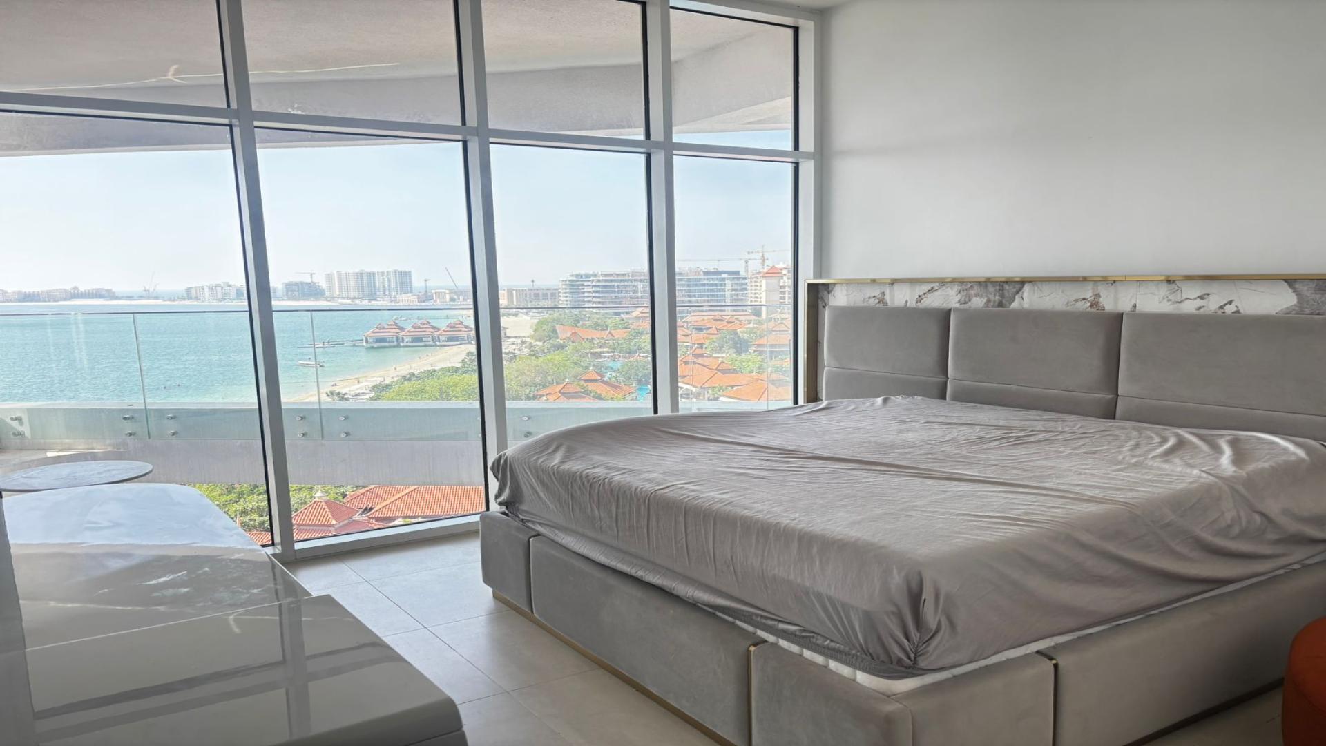Furnished living room in Azizi Mina apartment, Palm Jumeirah, with sea view balcony