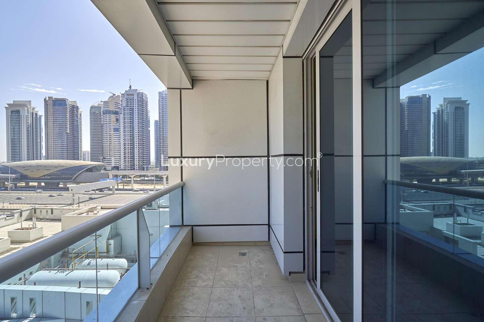 Spacious living room with large windows in Marina Diamond 1 apartment, Dubai Marina