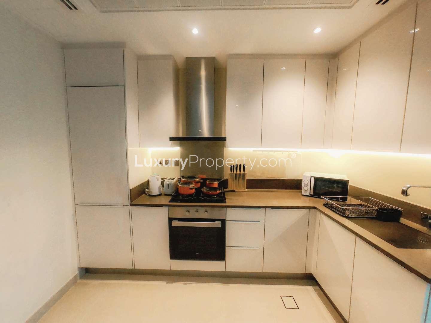 Fully furnished kitchen and dining area in Dubai Marina apartment, Marina Gate, pool view