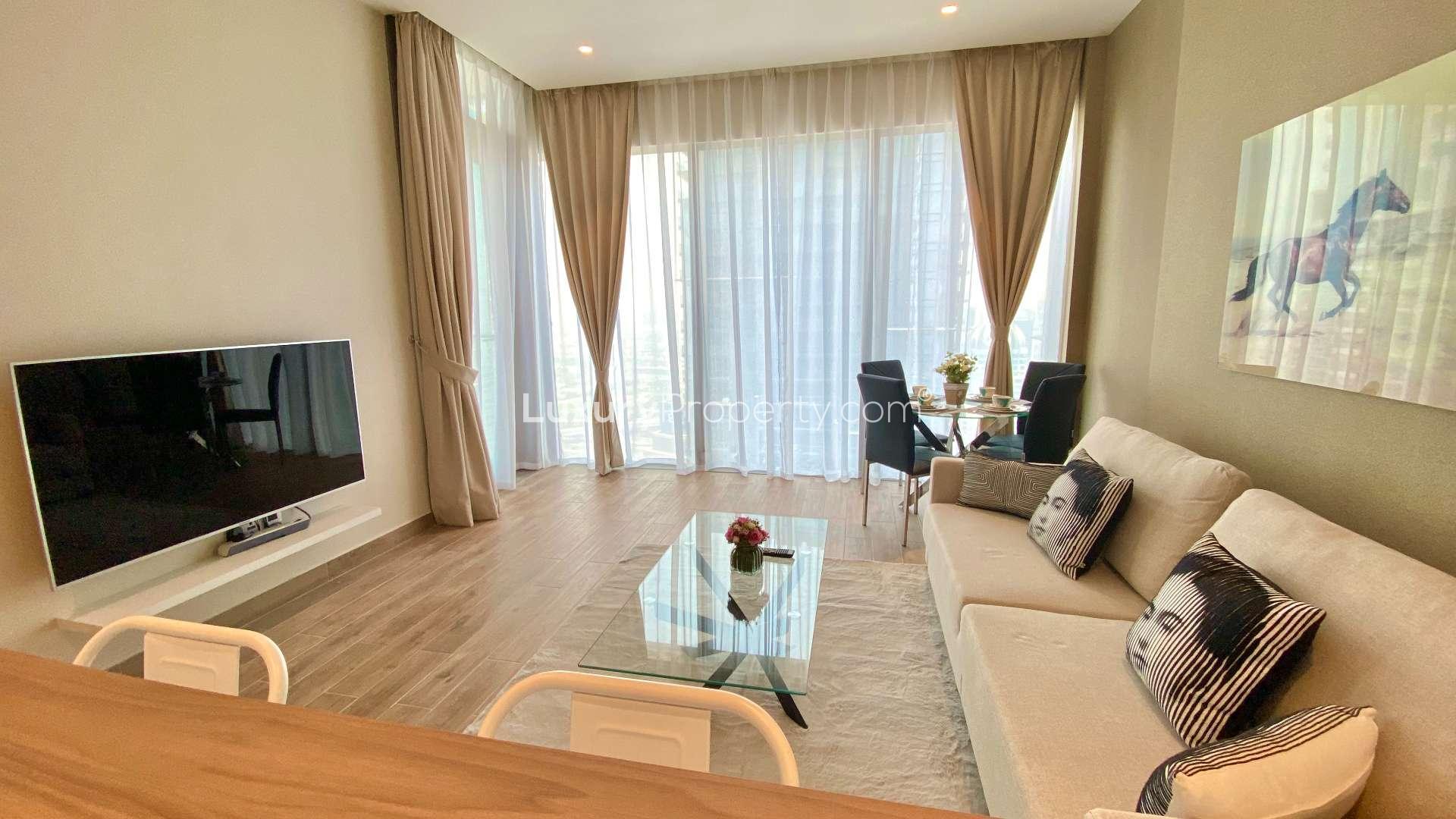 Luxurious Dubai Marina apartment interior with modern kitchen, cozy living area, elegant dining set
