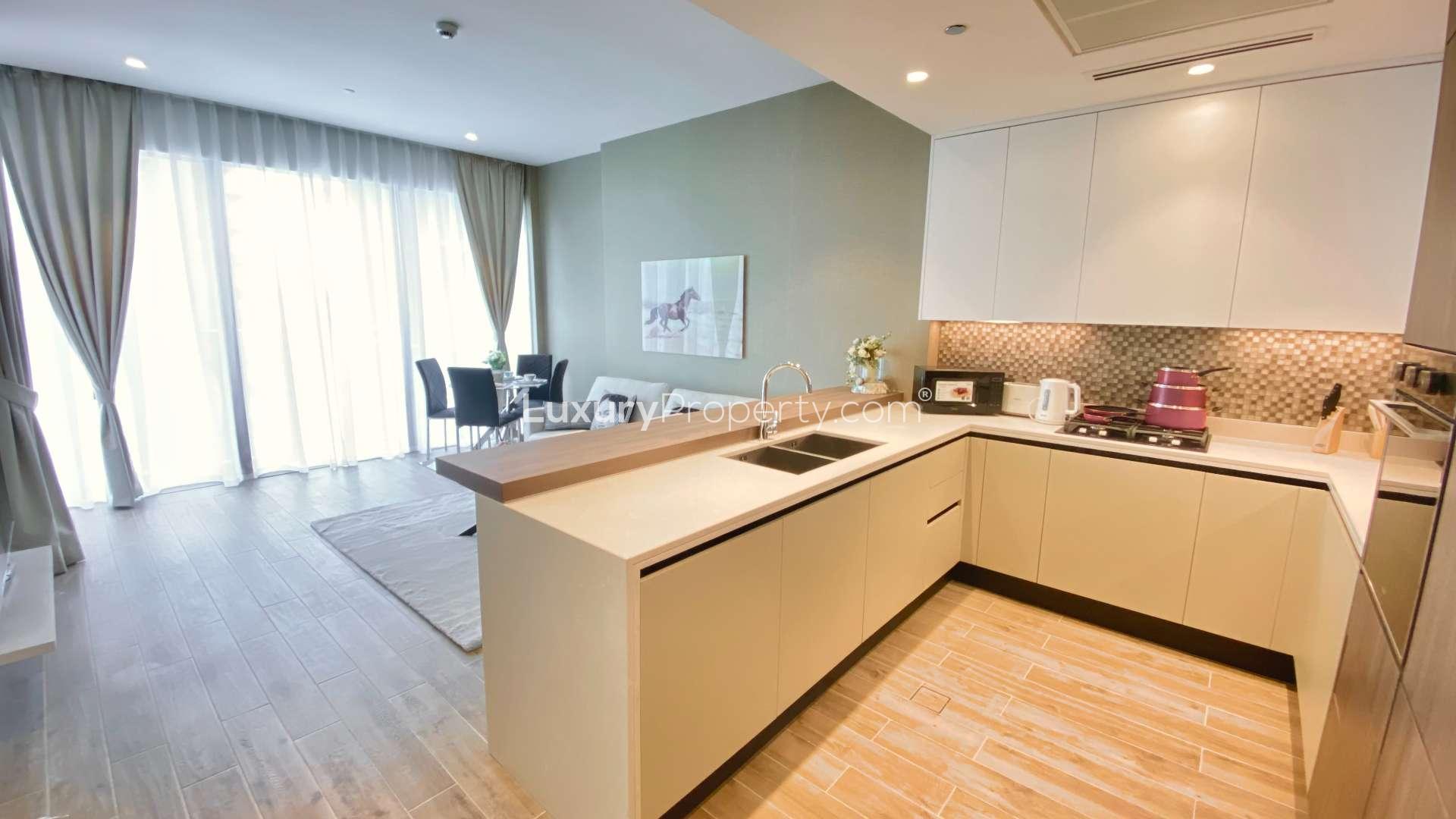 "Stunning balcony view from 1-bedroom apartment in Marina Gate, Dubai Marina, available for rent.",Luxurious kitchen and dining area in chic Dubai Marina apartment for rent
