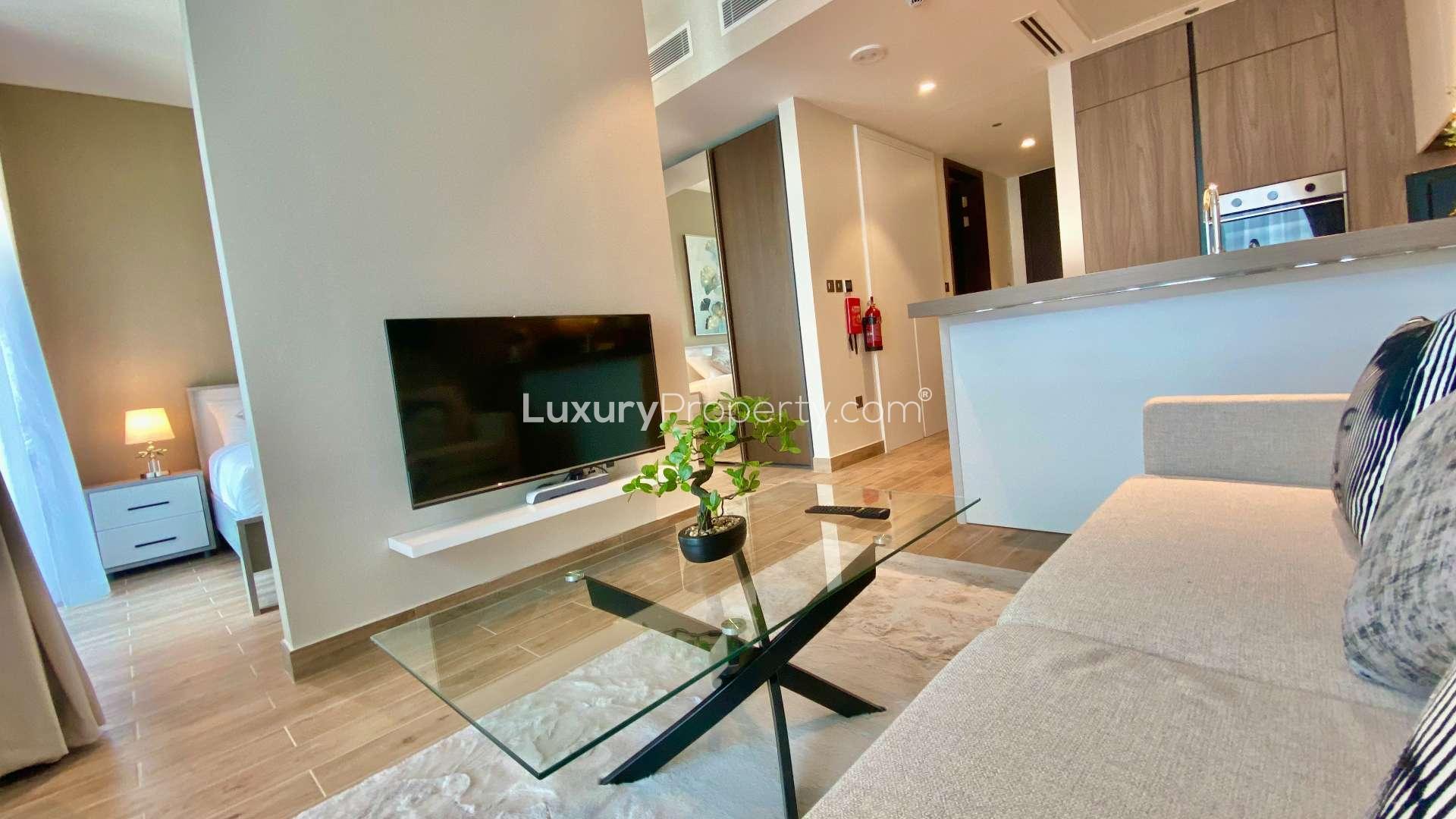 "Balcony view from luxury studio apartment in Dubai Marina, Marina Gate, with modern seating.",Luxurious furnished studio apartment living area in Marina Gate, Dubai Marina for rent