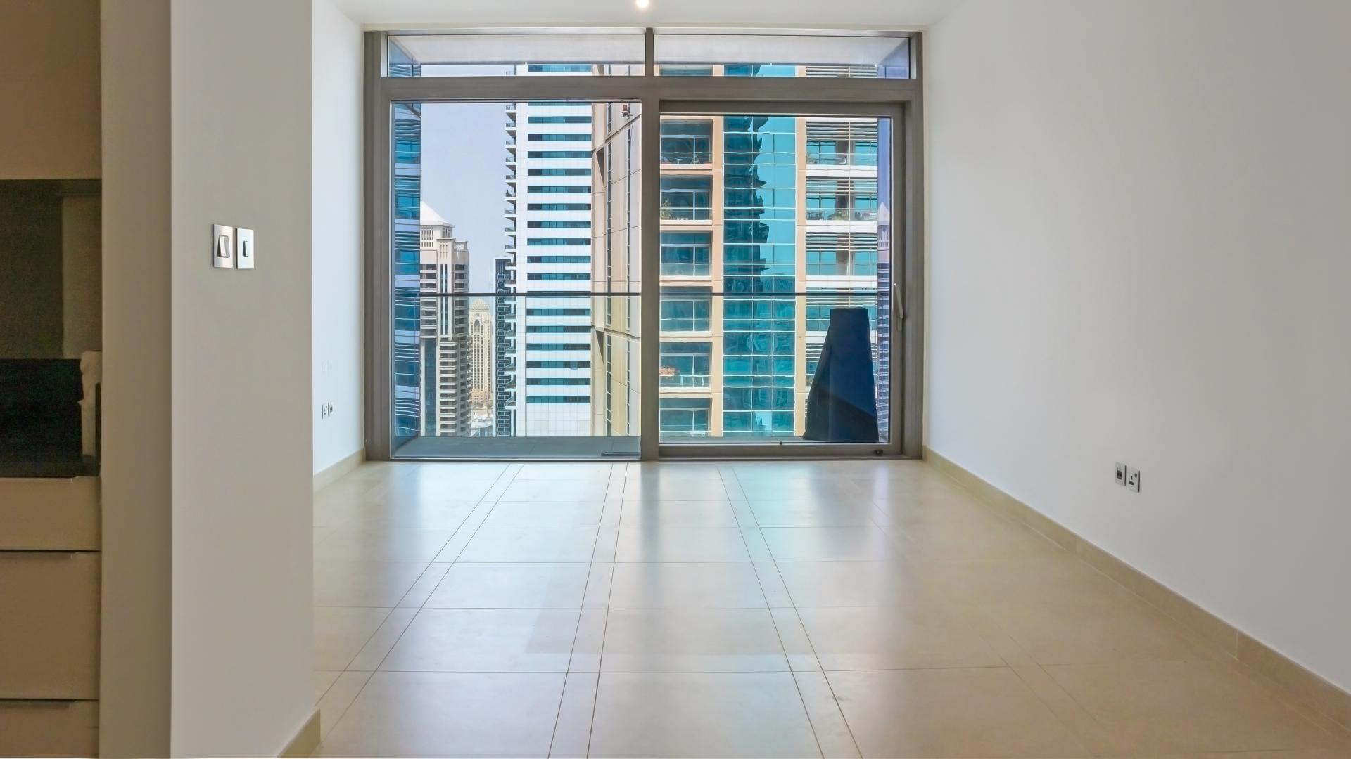 Modern apartment living room with large window view, Marina Gate, Dubai Marina