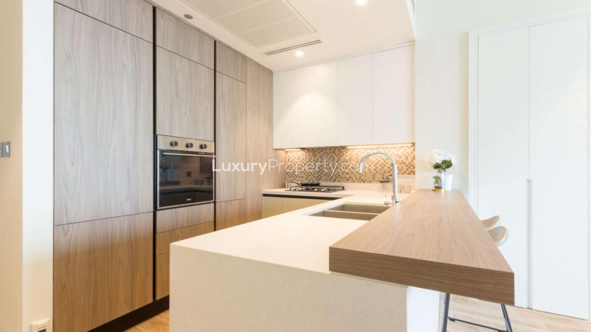 Fully furnished Dubai Marina apartment interior with modern kitchen and cozy living area
