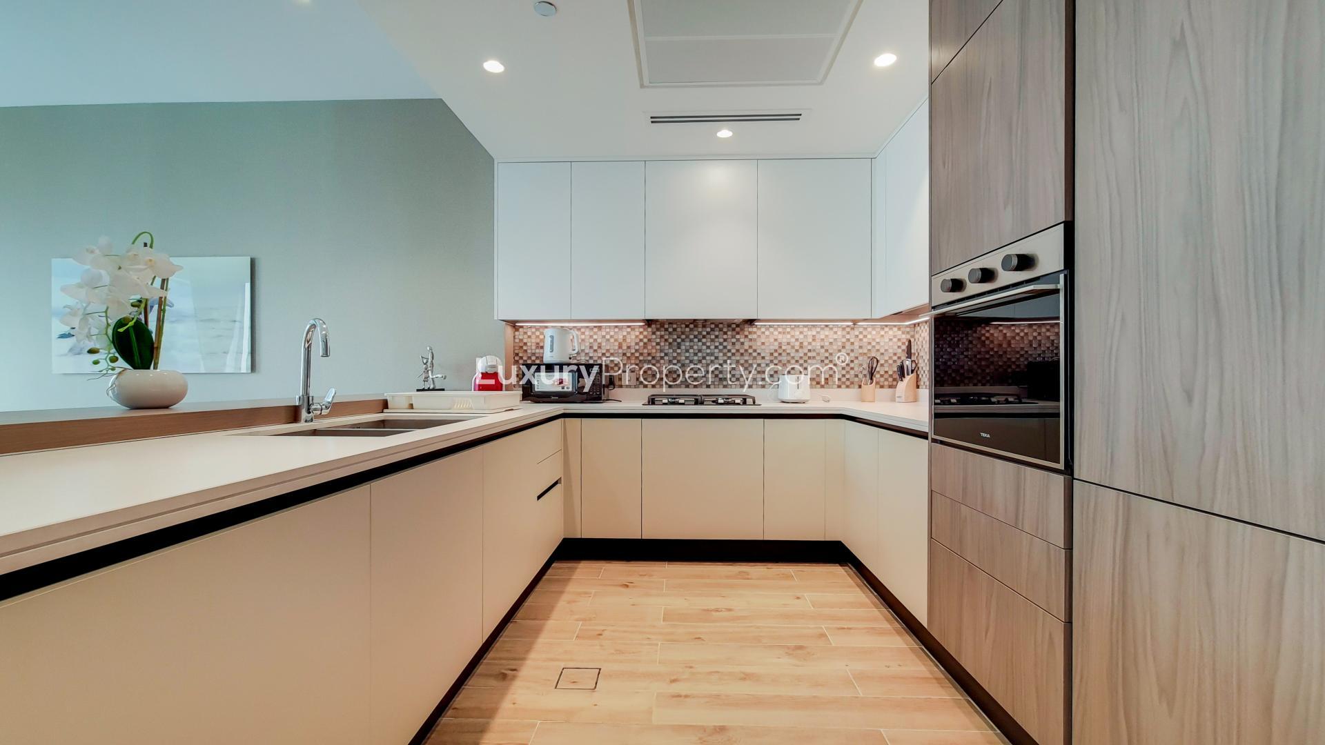 Modern living room in upgraded high-floor Dubai Marina apartment, featuring elegant decor and balcony