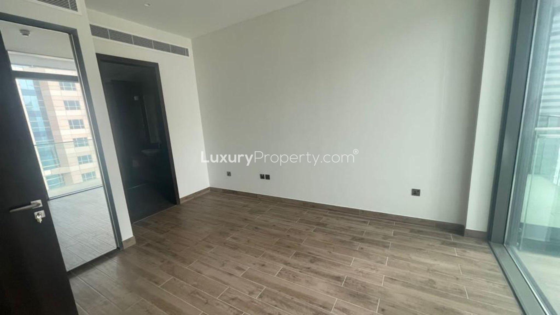 N/A,Empty modern apartment room with wood flooring, large window, Dubai Marina view, Marina Gate