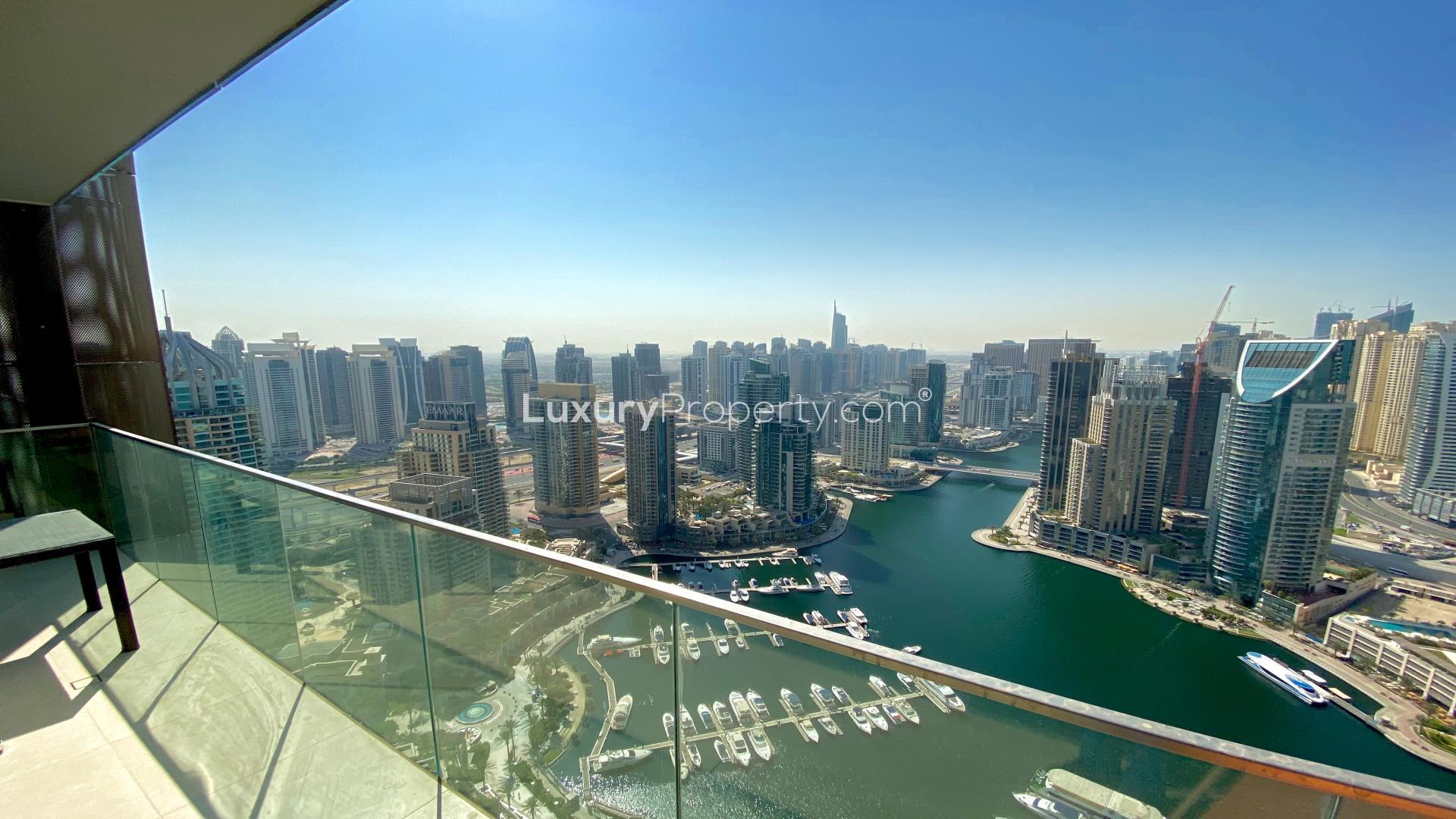 "Modern 1-bedroom apartment with marina view, open-plan living, dining in Dubai Marina.",Dubai Marina apartment balcony view of marina and skyline, Marina Gate community, for rent