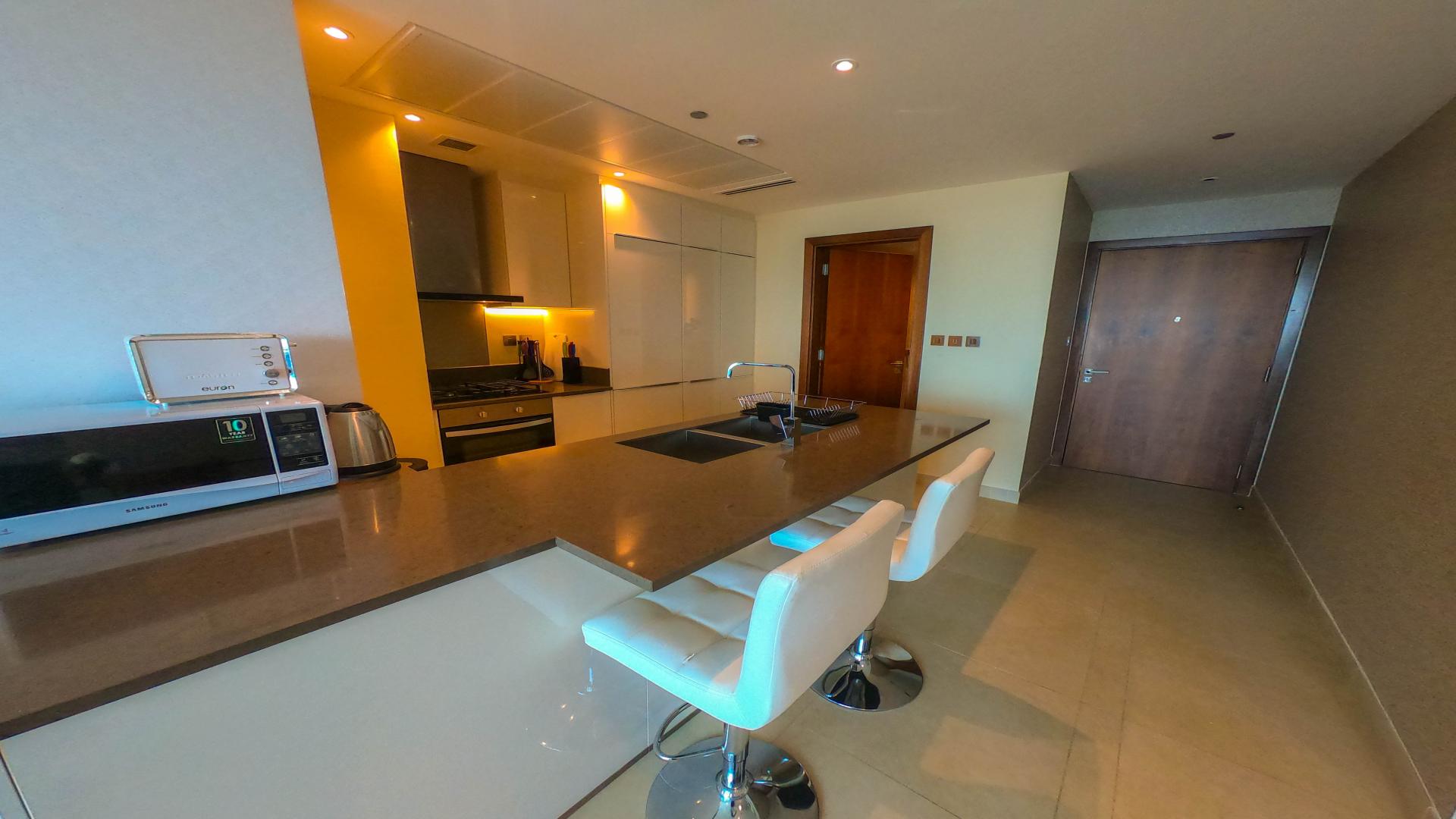 Modern living room with city view in Dubai Marina apartment, Marina Gate