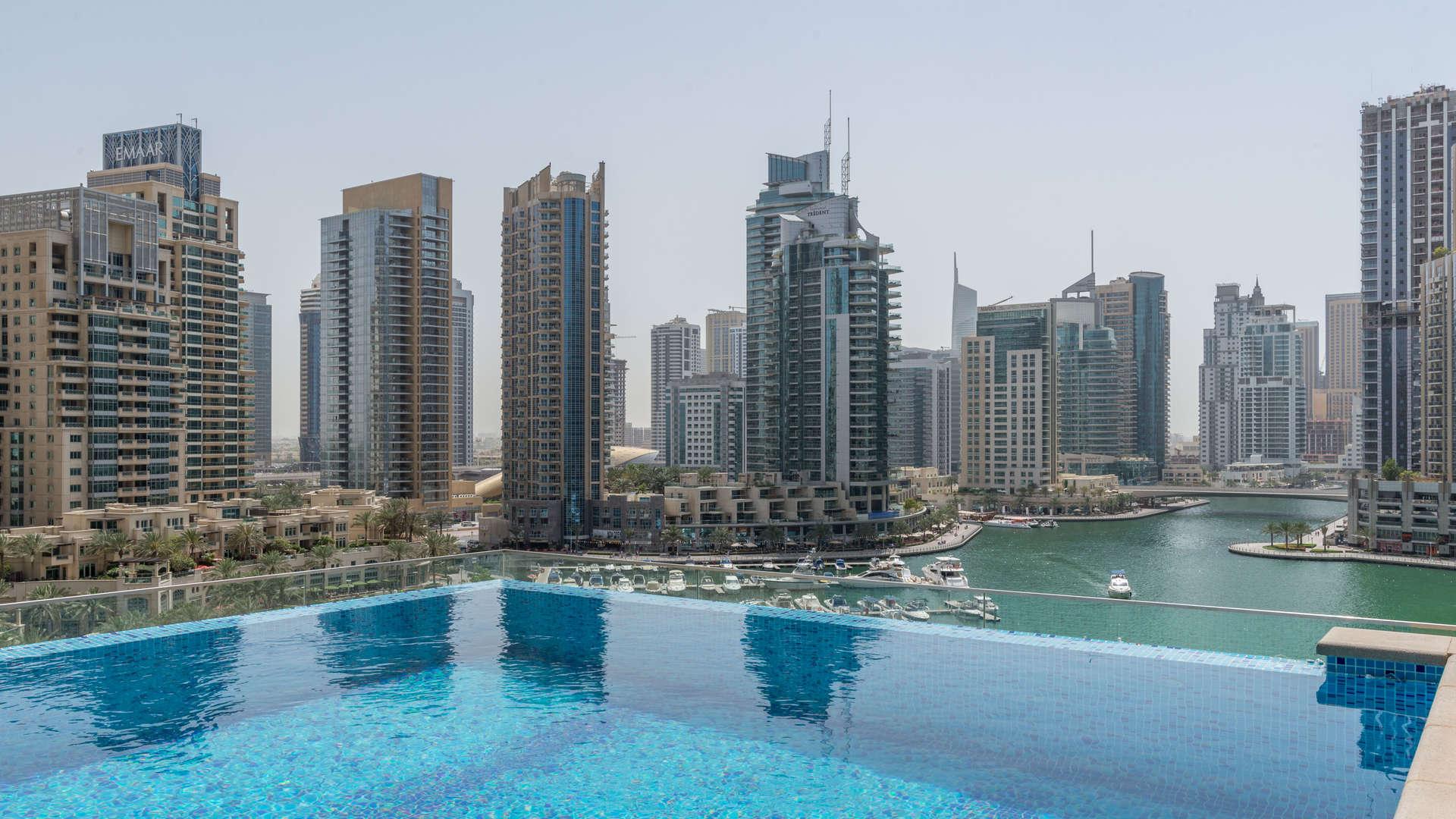 Aerial view of Dubai Marina and yachts near Marina Gate apartment for rent