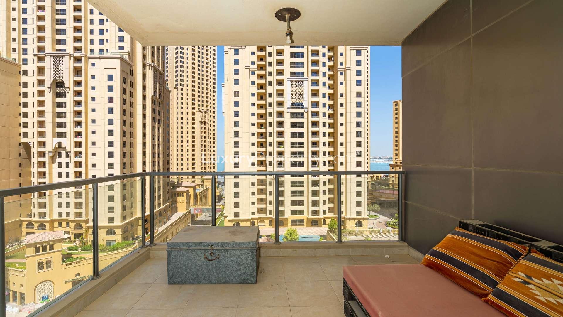 Elegant living room with large windows overlooking Marina Quays, Dubai Marina apartment for rent