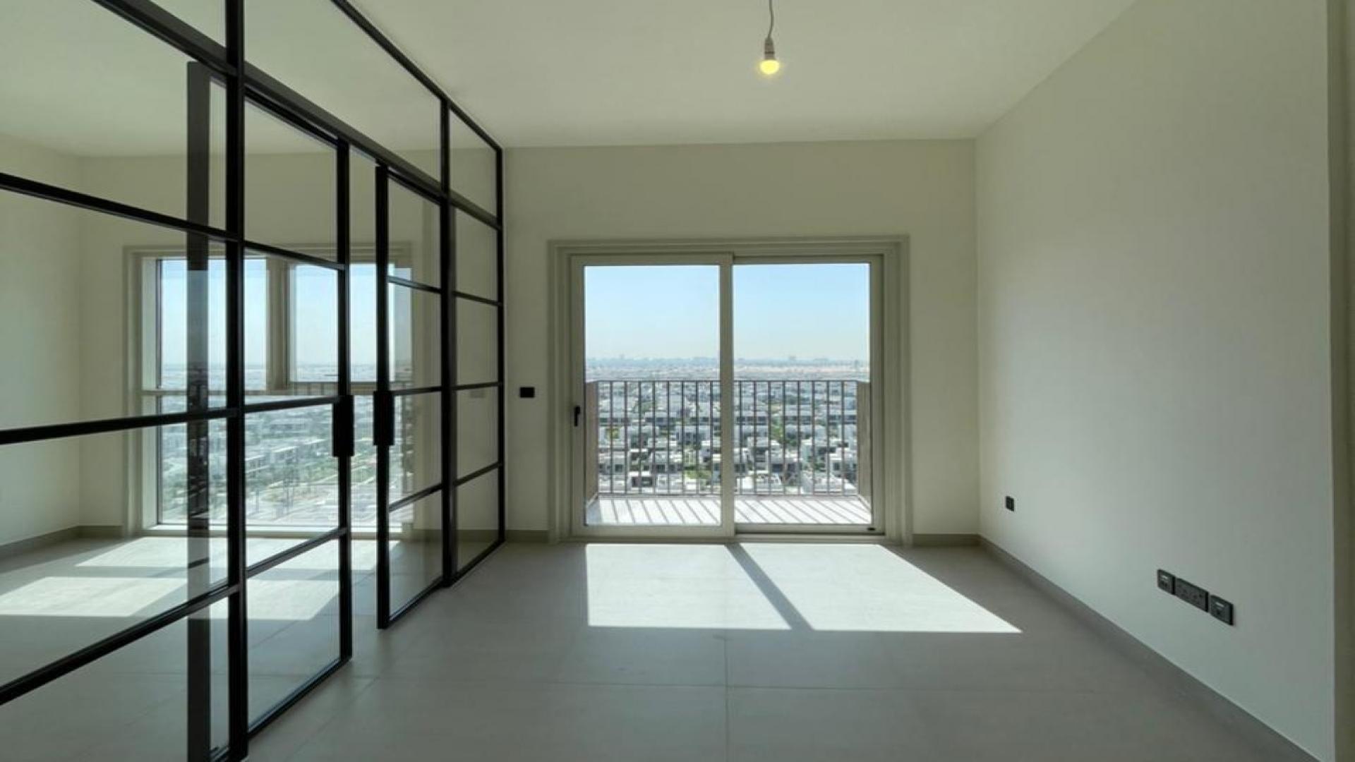 Stylish apartment interior with large window view in Dubai Hills Estate, Collective community