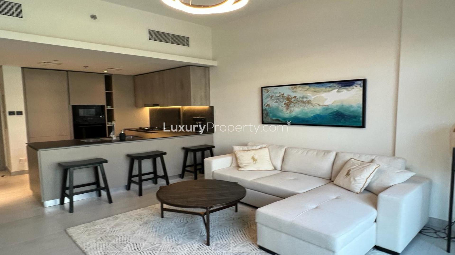 Furnished apartment living area with modern kitchen, Jumeirah Village Circle, Oxford Boulevard