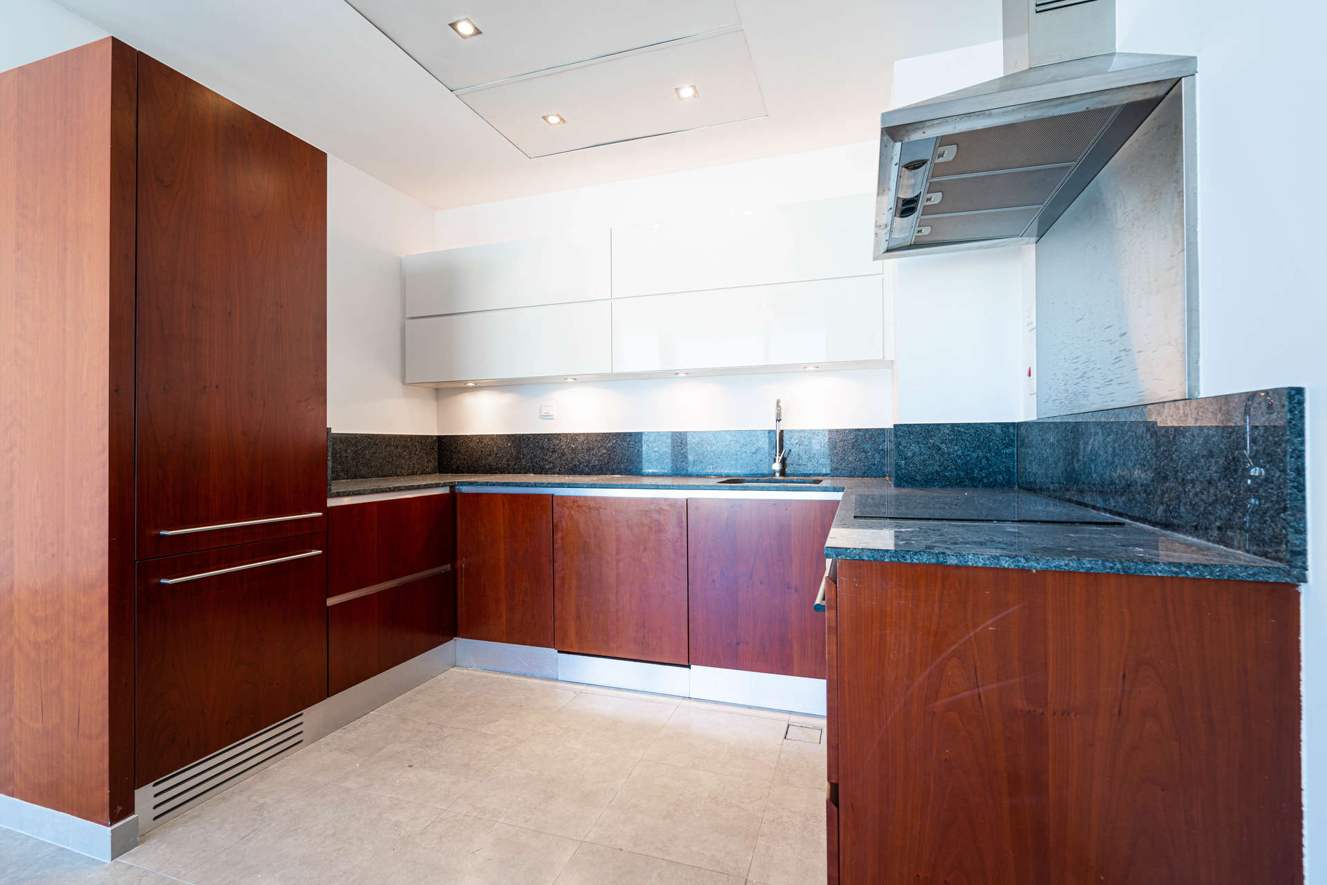 Spacious DIFC apartment with skyline views, large windows, and wooden wardrobe in Maze Tower