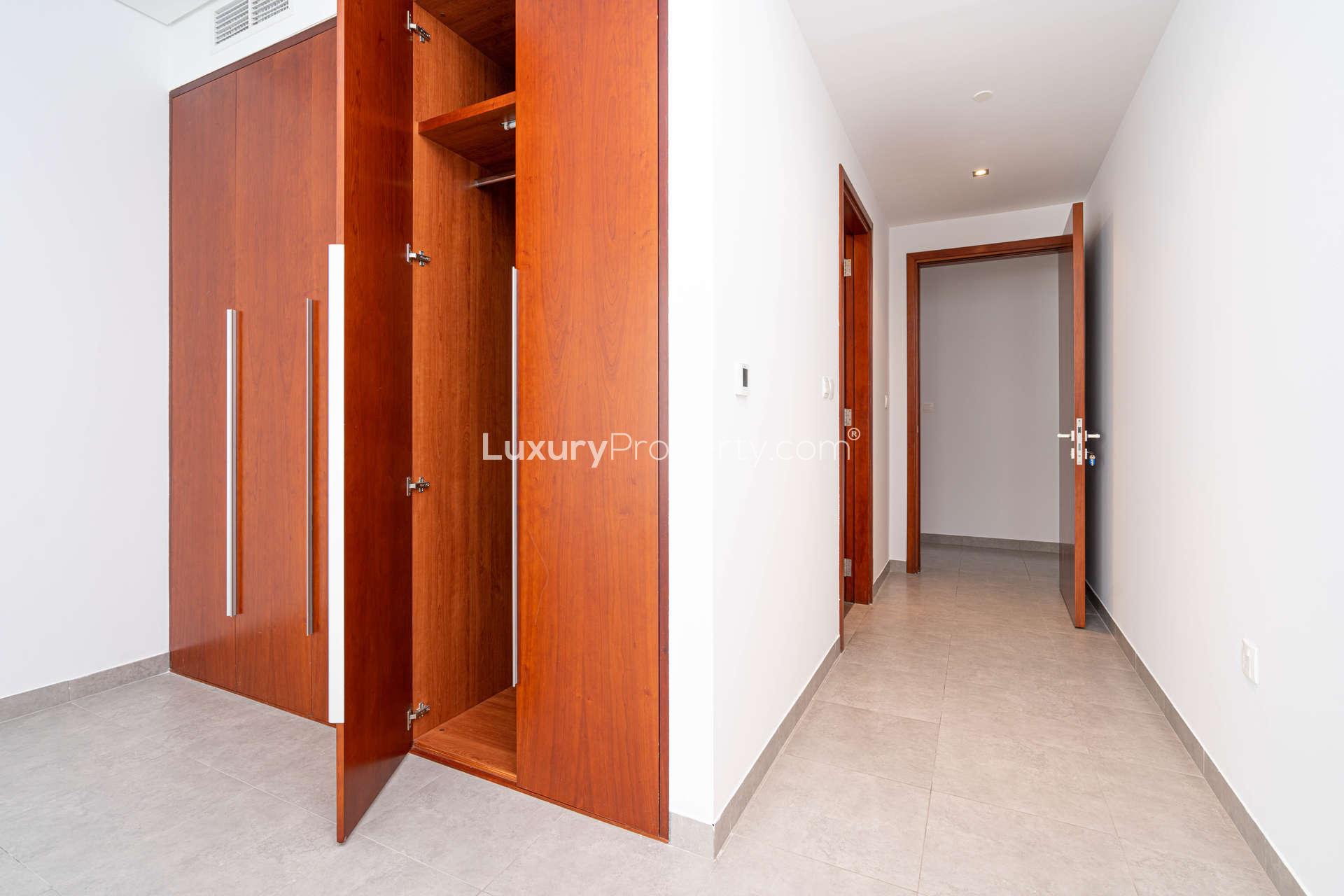 Modern kitchen in 1-bedroom apartment, Maze Tower, DIFC, with sleek cabinetry and granite countertops