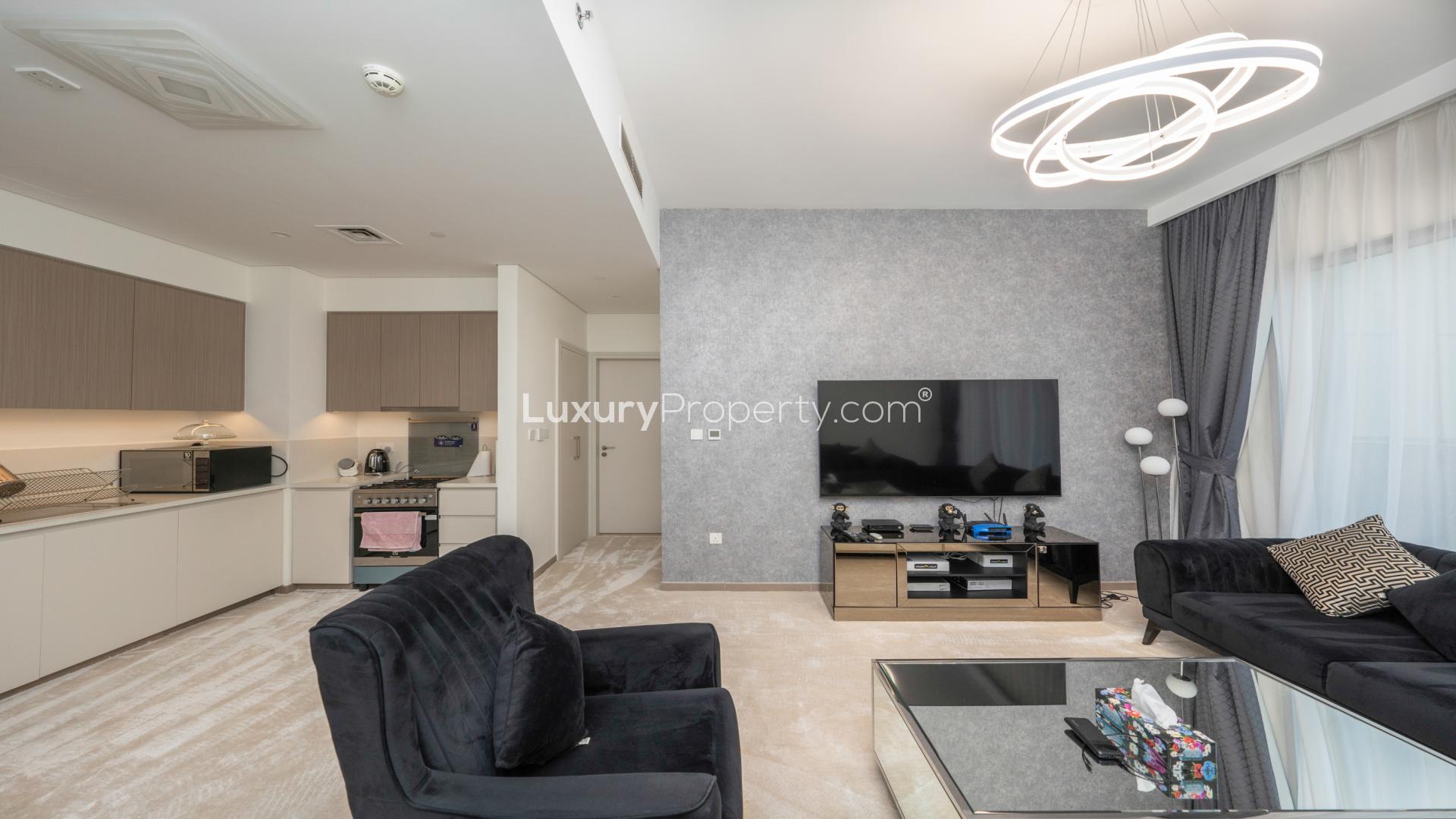 Modern living room in Park Heights apartment, Dubai Hills Estate, with sleek decor and balcony view