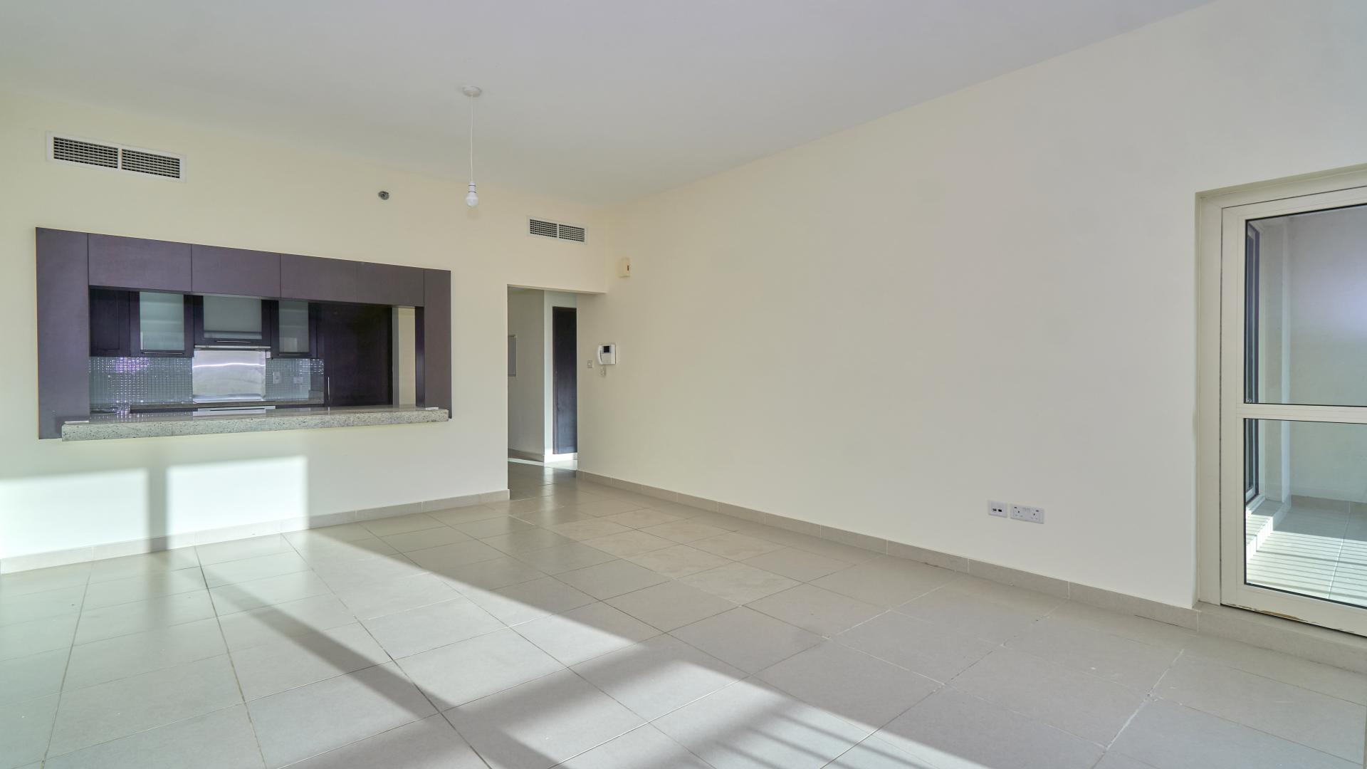 Mid-floor apartment kitchen with modern cabinetry in The Views, Dubai, available for rent