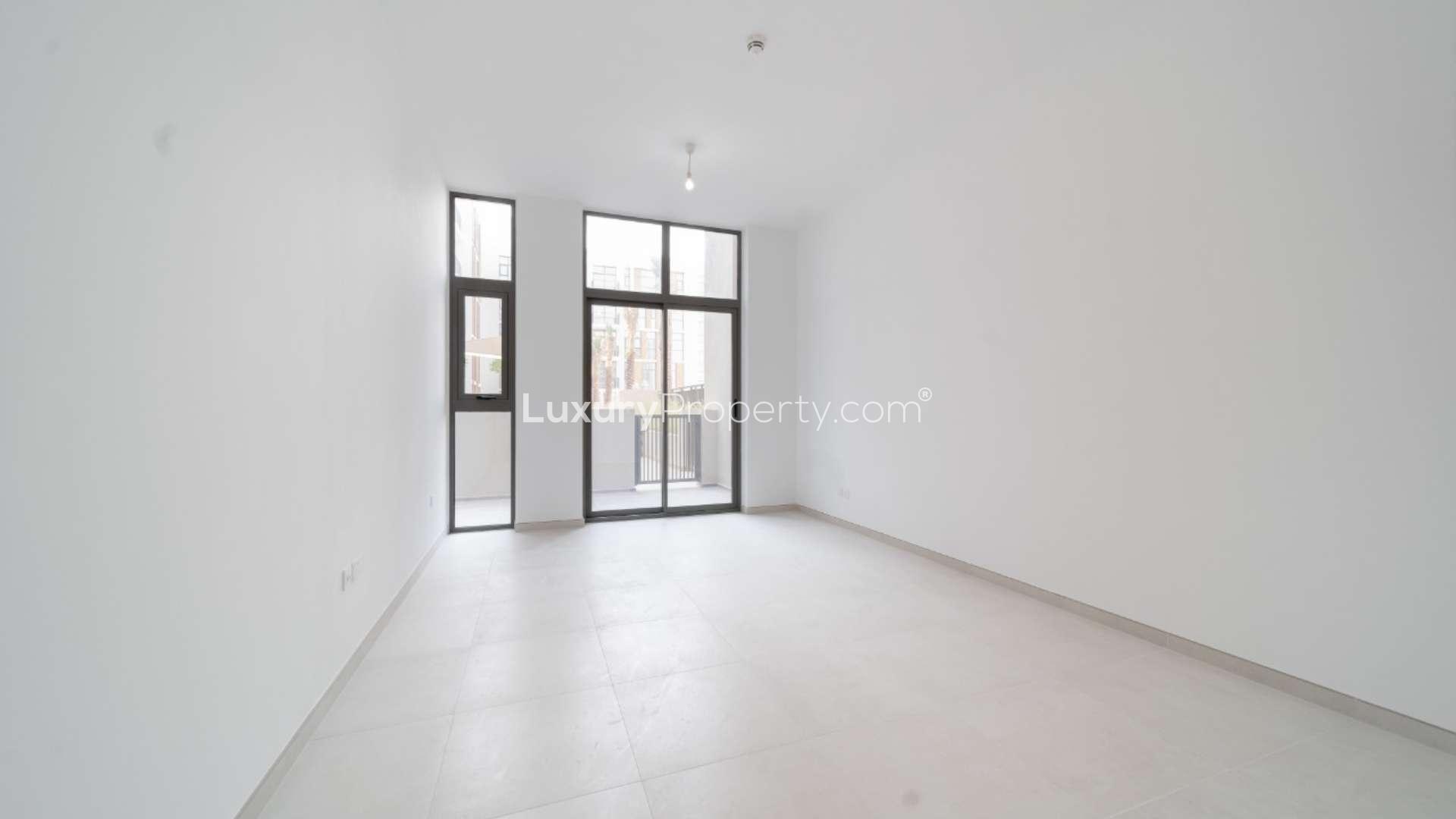 Modern living room in Mudon Views 1-bedroom apartment with open layout and bright interior