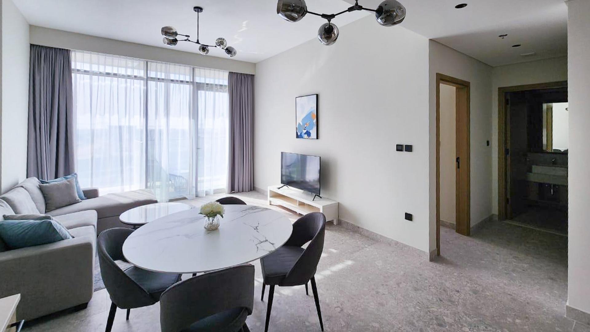 Fully furnished living room in Golf Suites apartment, Dubai Hills Estate, with modern decor