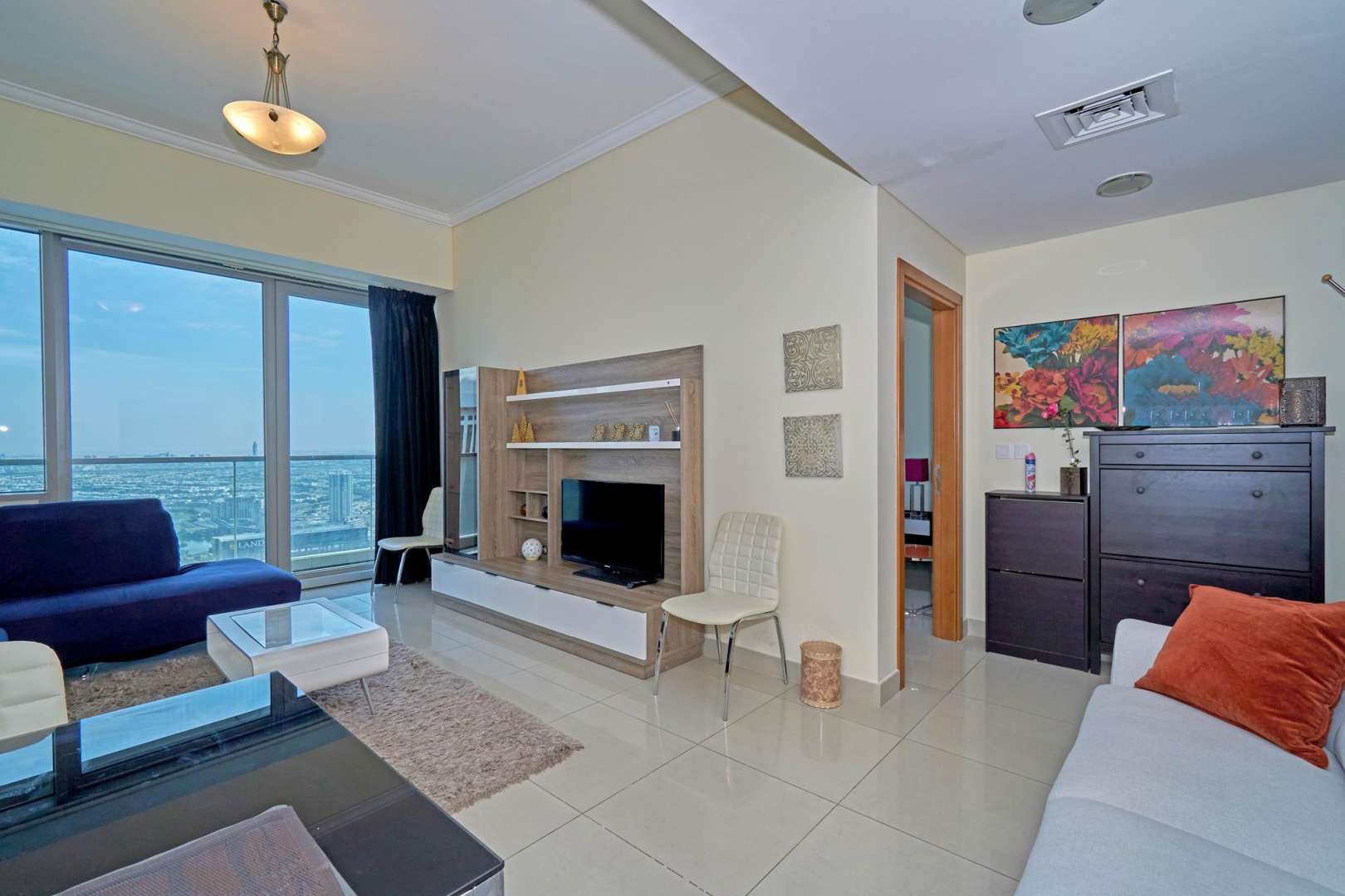 Fully furnished living room in Ocean Heights apartment, Dubai Marina, with modern decor and views