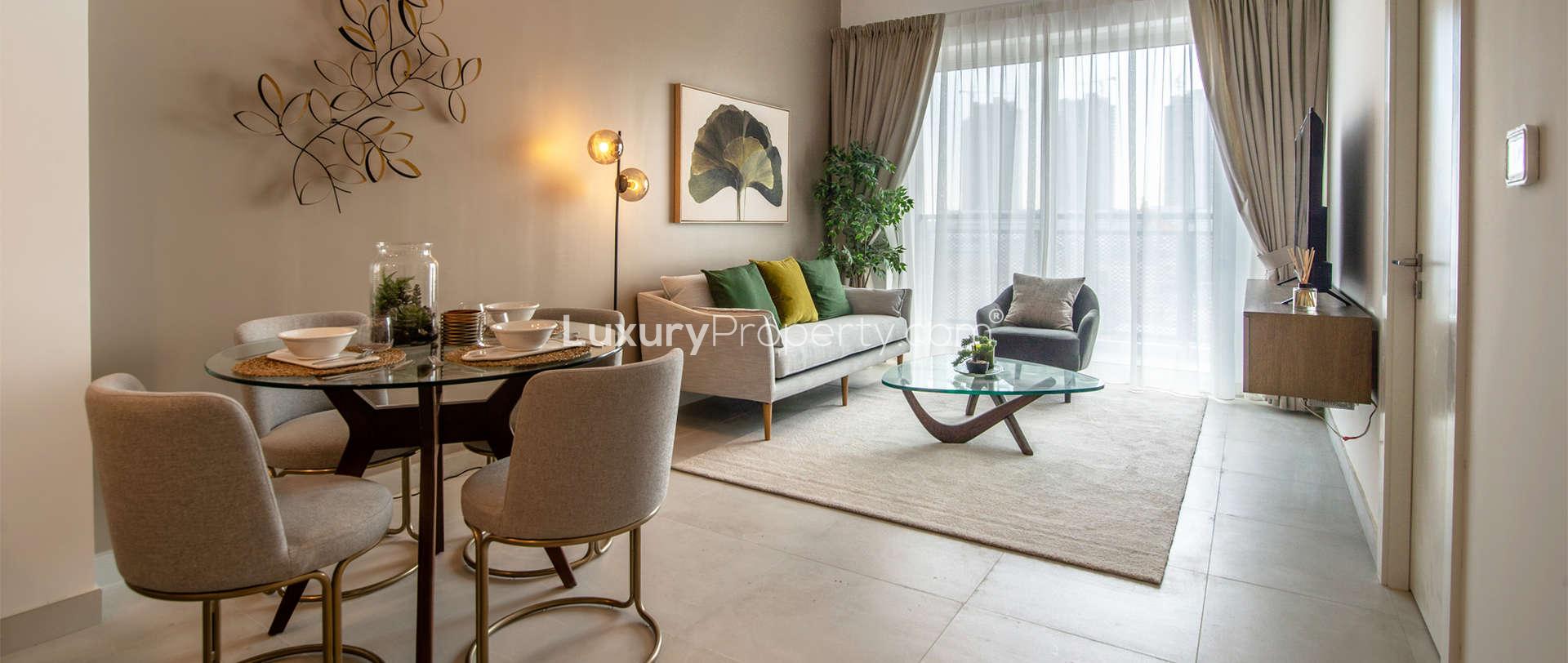 Outdoor terrace with modern furniture in Olivara Residences, Dubai Studio City apartment