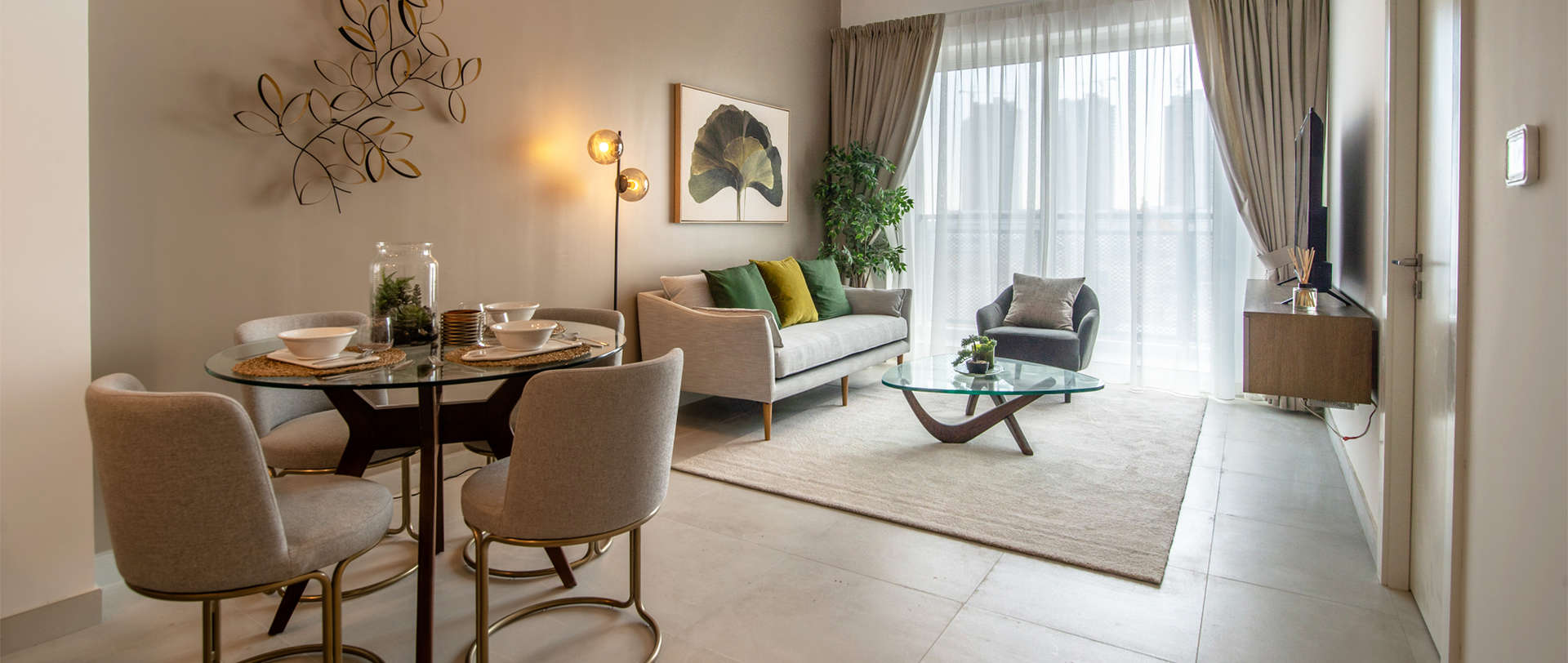 Outdoor terrace with modern furniture in Olivara Residences, Dubai Studio City apartment