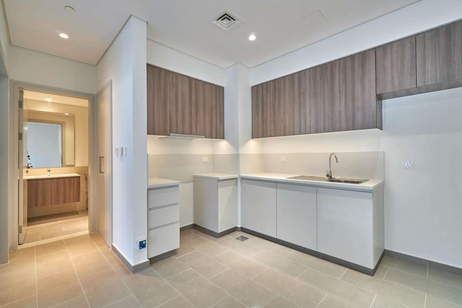 Empty living room with balcony view in Park Heights 1, Dubai Hills Estate apartment