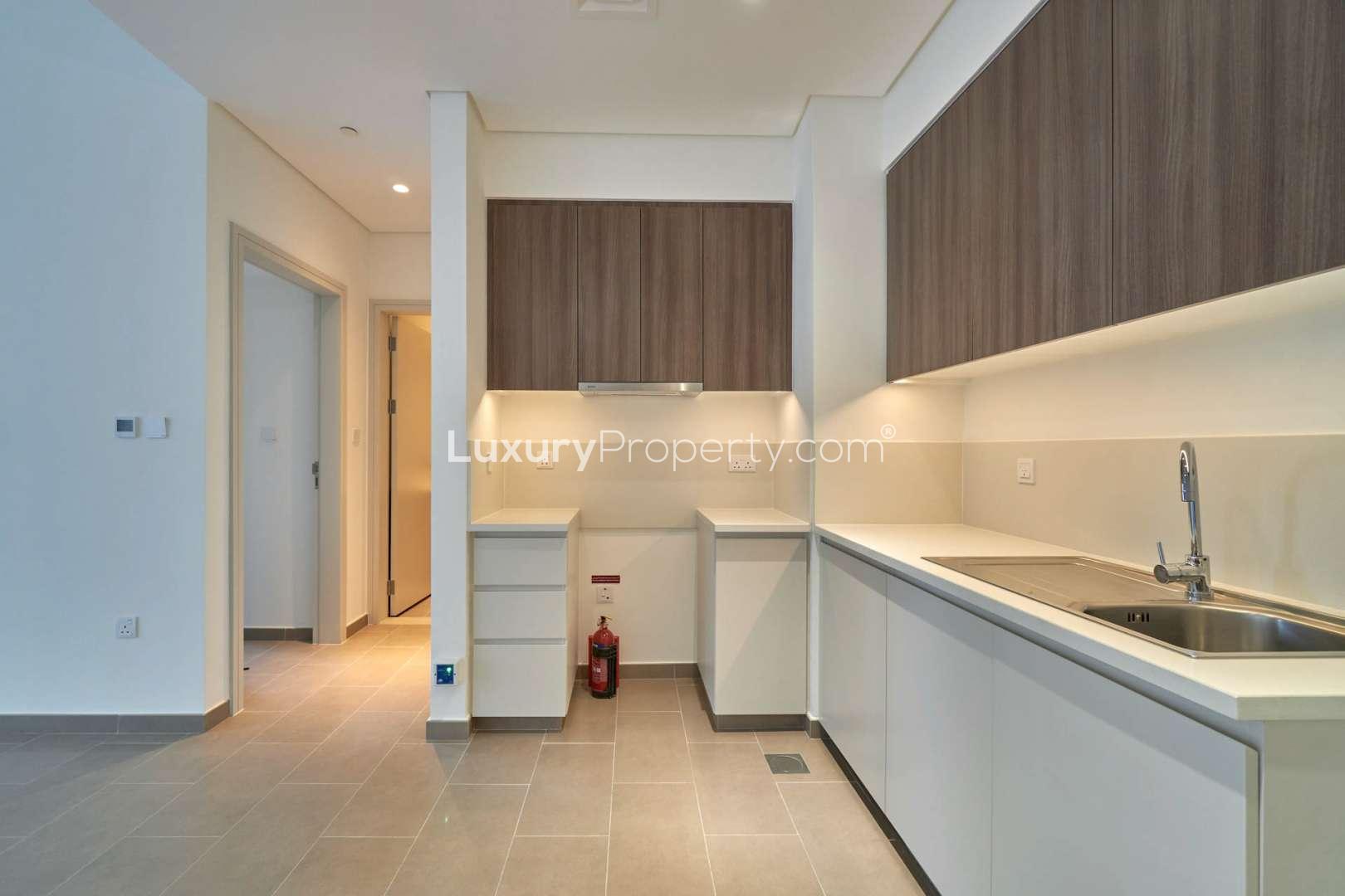 Modern apartment interior with open kitchen in Park Heights, Dubai Hills Estate for rent
