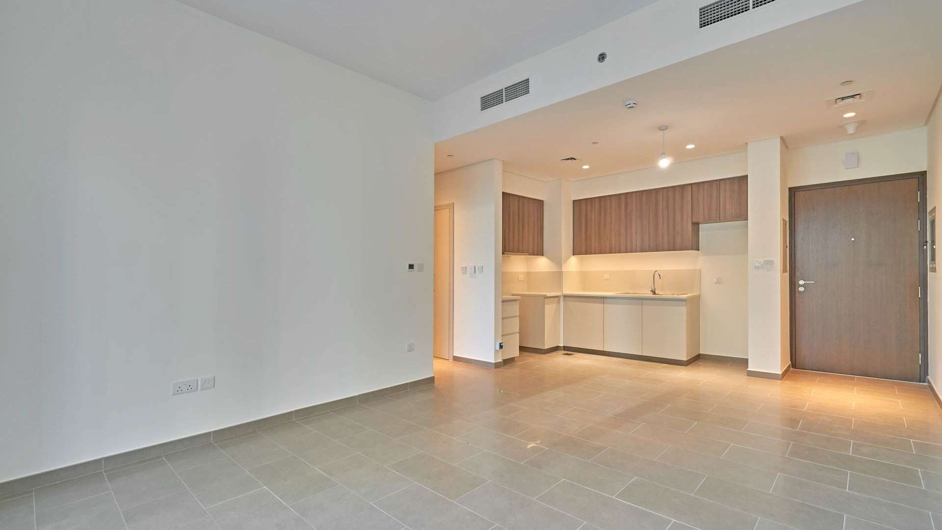 Exterior view of Park Heights apartment buildings in Dubai Hills Estate, clear blue sky