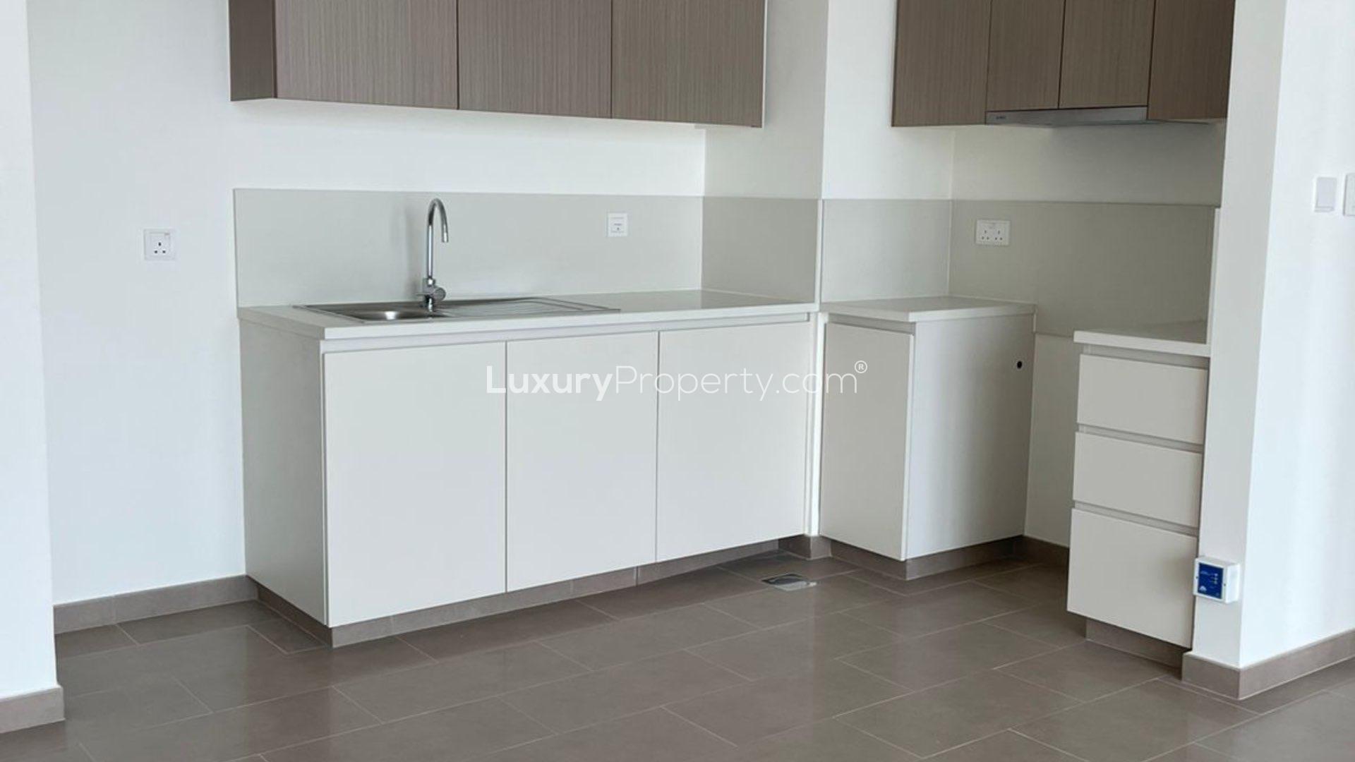"Scenic city view from Park Heights apartment balcony in Dubai Hills Estate, Dubai.",Modern kitchen in brand new 1-bedroom apartment, Park Heights, Dubai Hills Estate