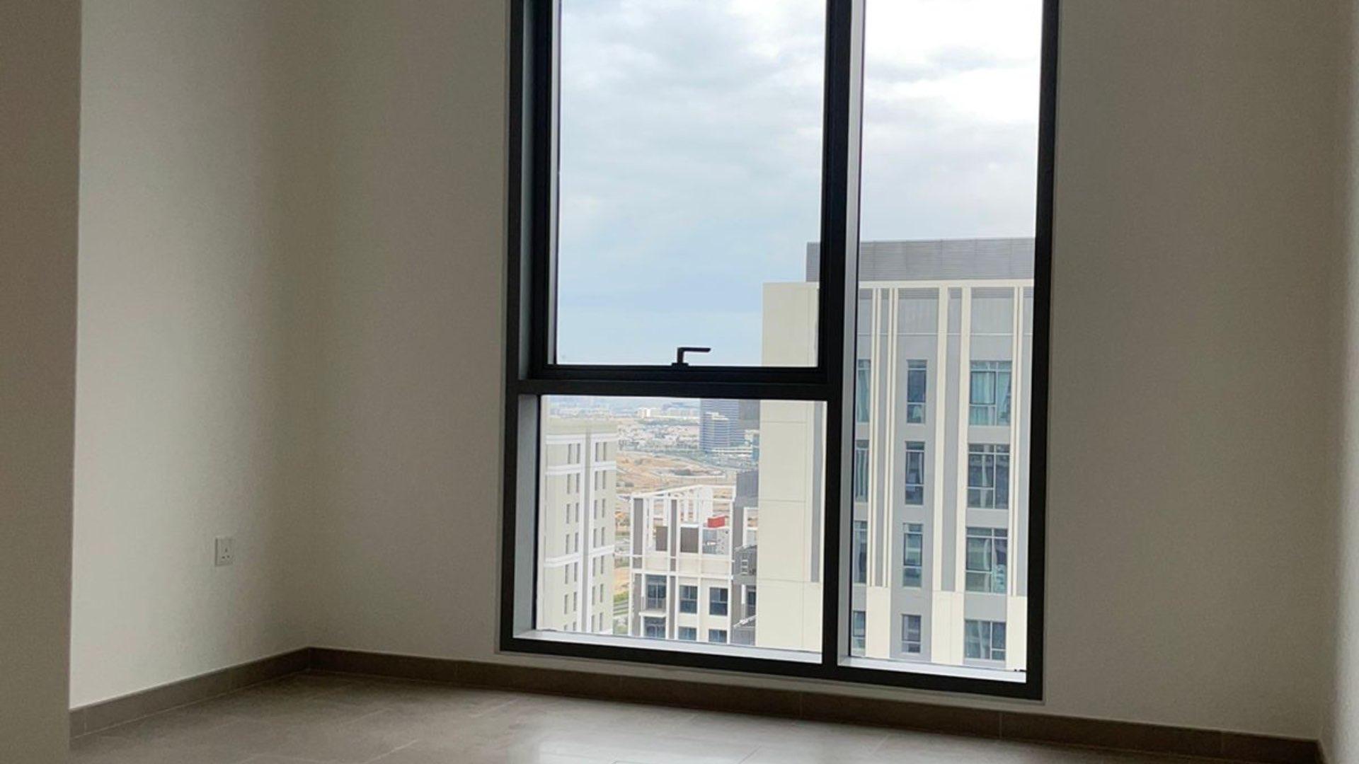 Empty room with large window view in Park Heights, Dubai Hills Estate apartment
