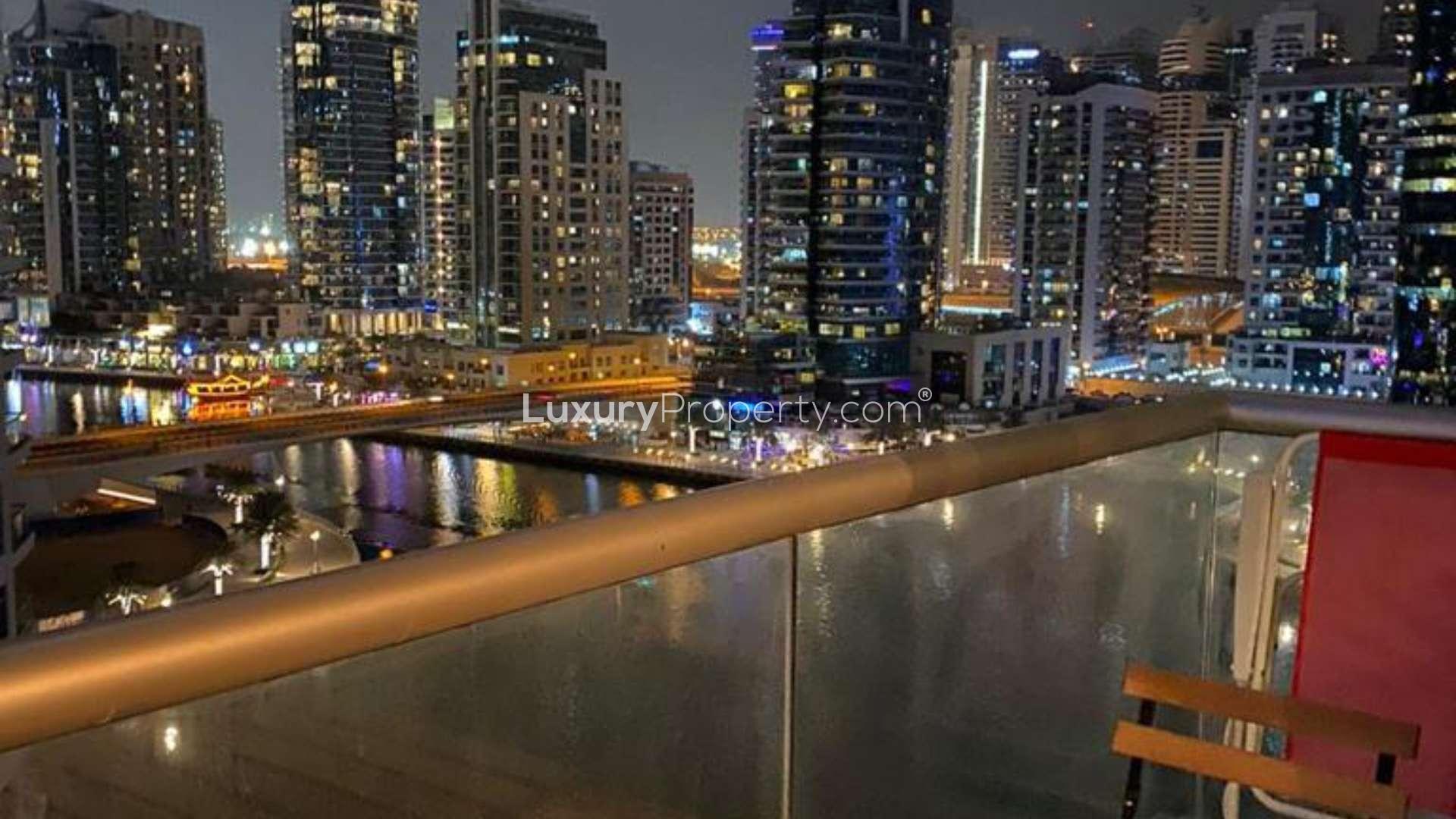 Spacious Dubai Marina apartment living room with modern decor and large window view