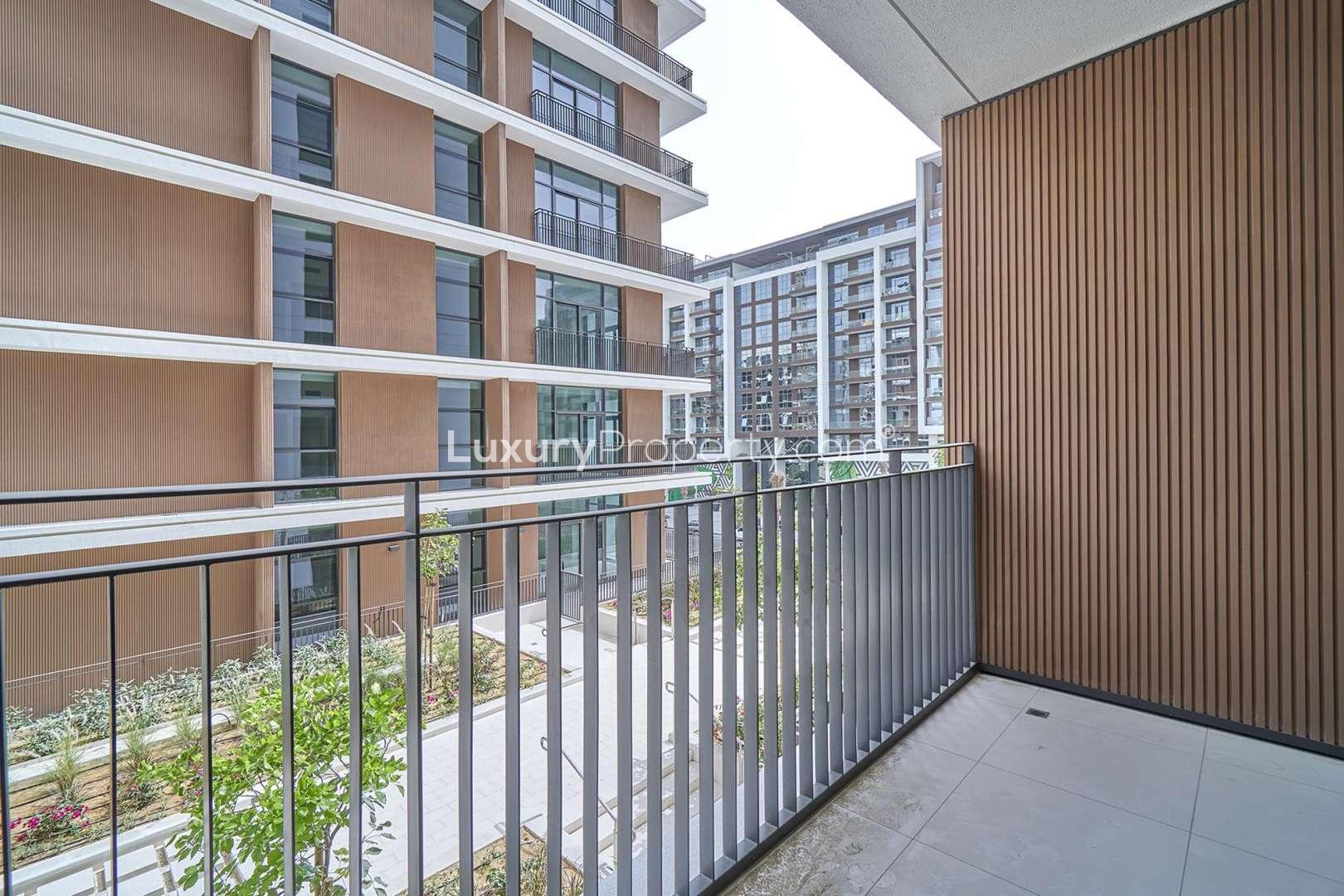 Empty living room with large windows in Park Point, Dubai Hills Estate apartment for rent