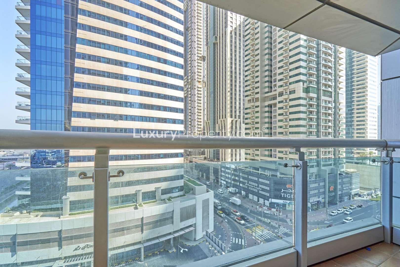 Empty bedroom with balcony view in Princess Tower, Dubai Marina apartment for rent