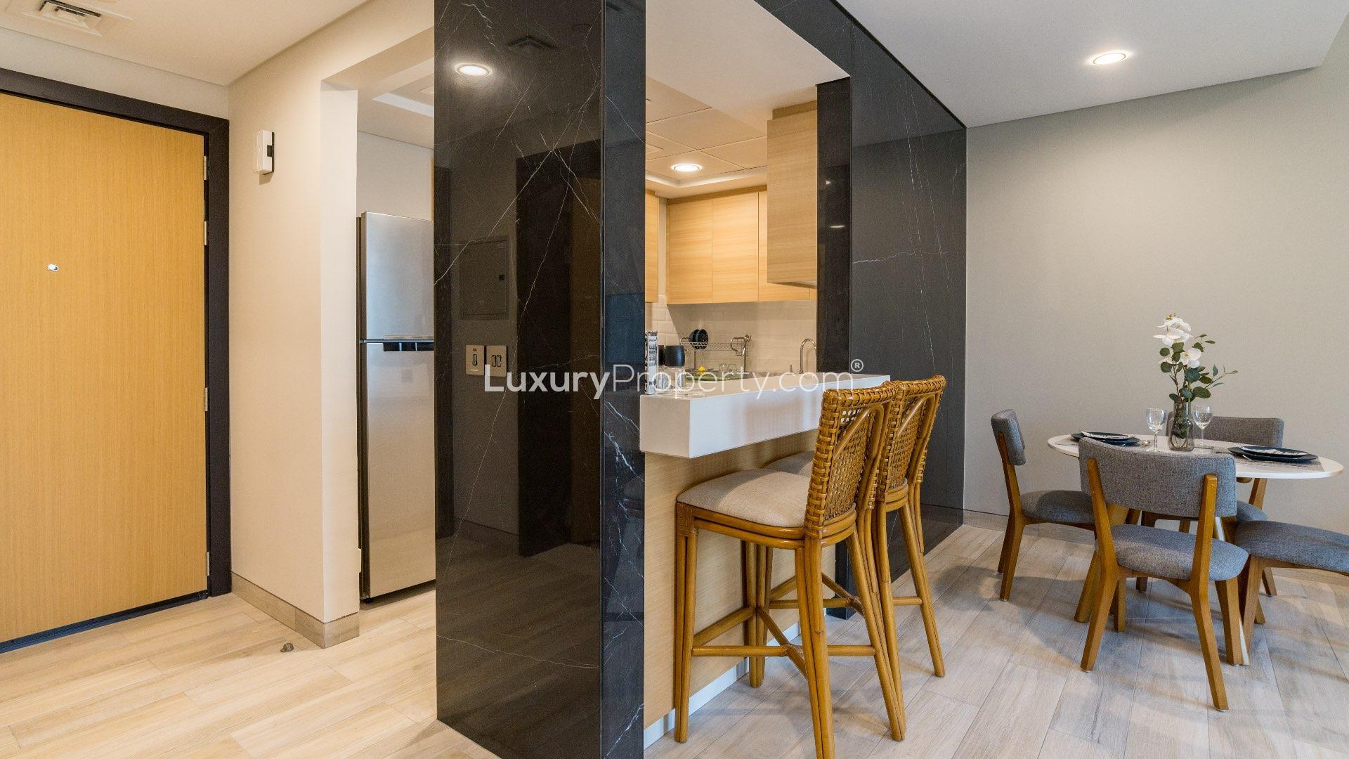 Furnished living room in Swiss-built 1-bedroom apartment, Priva Living, Arjan, with premium amenities