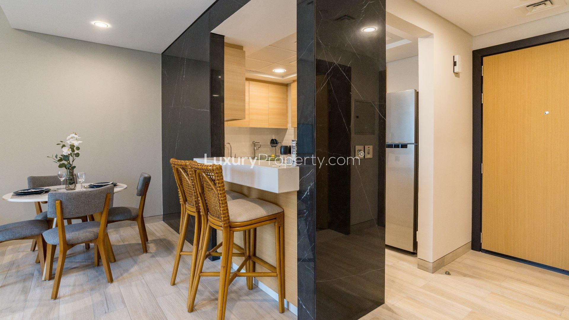 Modern bathroom with sleek sink and mirror in Priva Living apartment, Arjan