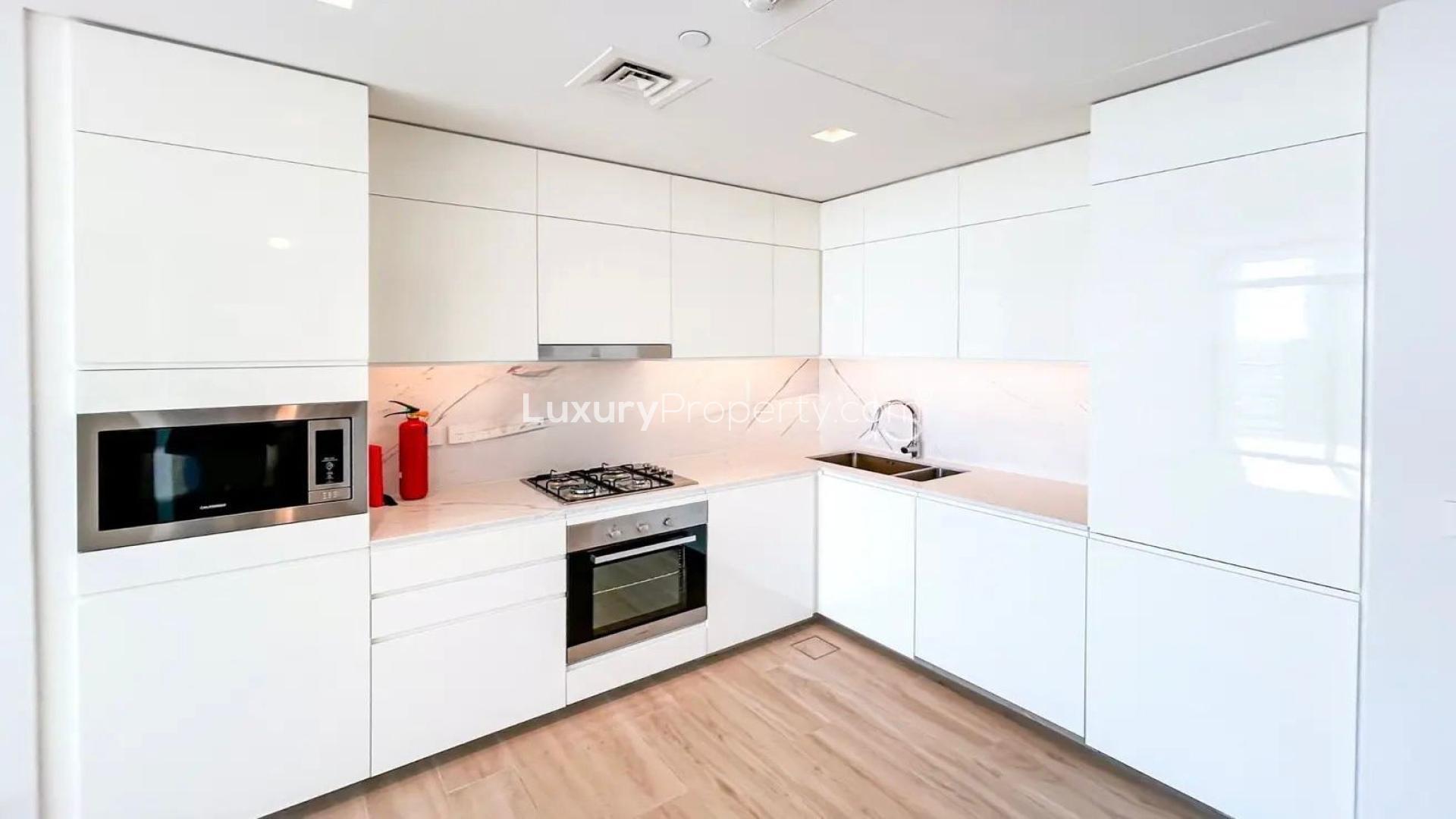 Bright living room with floor-to-ceiling windows in Palace Residences, Dubai Creek Harbour apartment