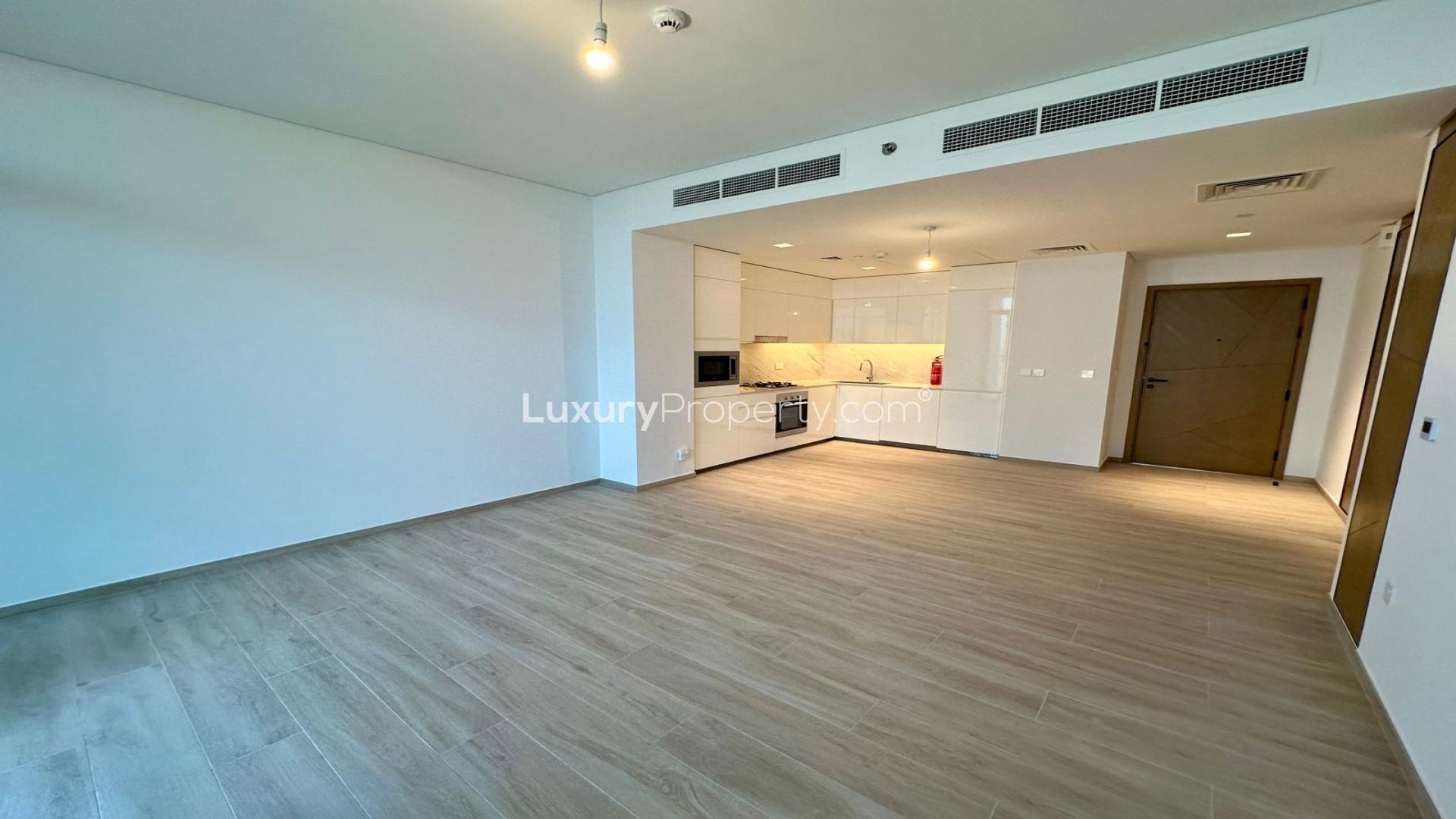 Modern kitchen and living area in Palace Residences apartment, Dubai Creek Harbour