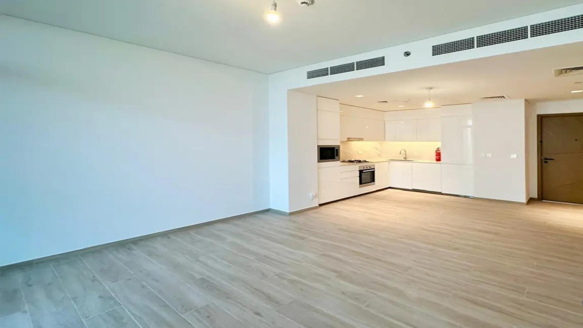 Modern open-plan kitchen and living area in Palace Residences, Dubai Creek Harbour apartment